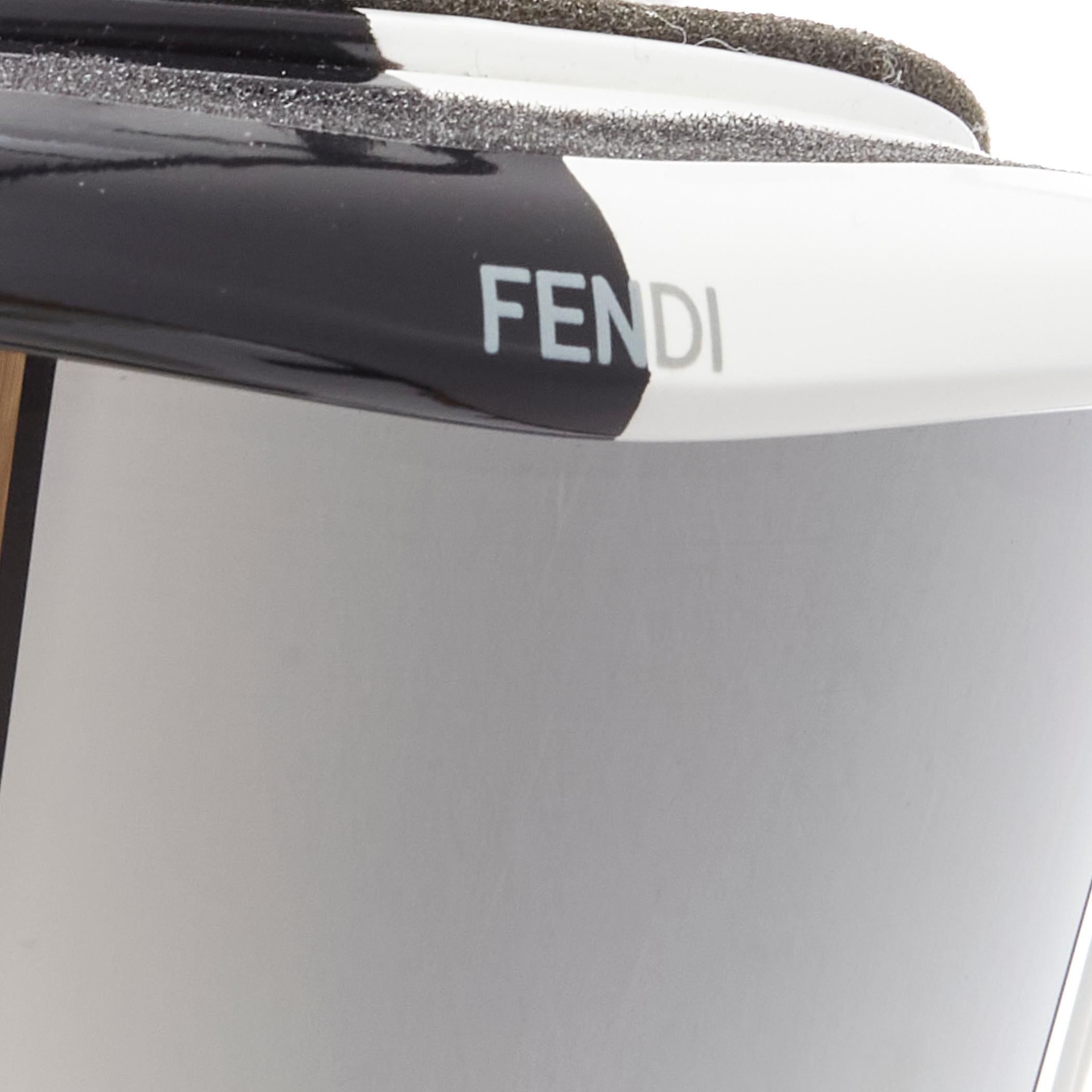 FENDI Split black white bicolor mirrored lens ski goggles Unisex
Brand: Fendi
Material: Plastic
Color: Black
Pattern: Solid
Closure: Elasticated
Made in: Italy

CONDITION:
Condition: Excellent, this item was pre-owned and is in excellent condition.