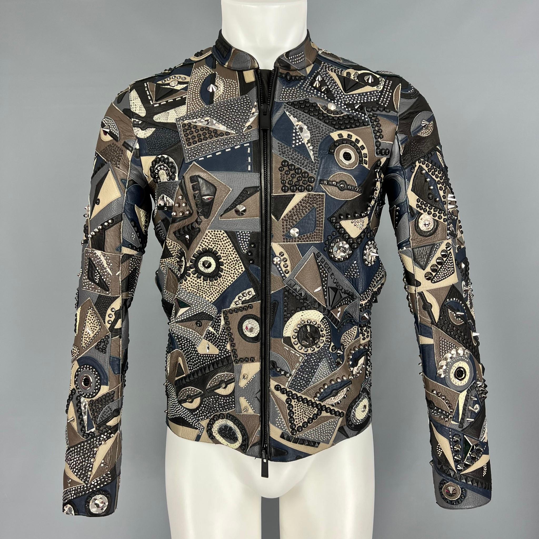 Fendi Lamb, Deer and Water Snake (Python) Leather Moto Jacket from the Spring 2016 Menswear Collection featuring hues of Grey, Blue and Beige, allover iconic monster eye design with subtle owl eyes.  Studded accents throughout in various sizes. 