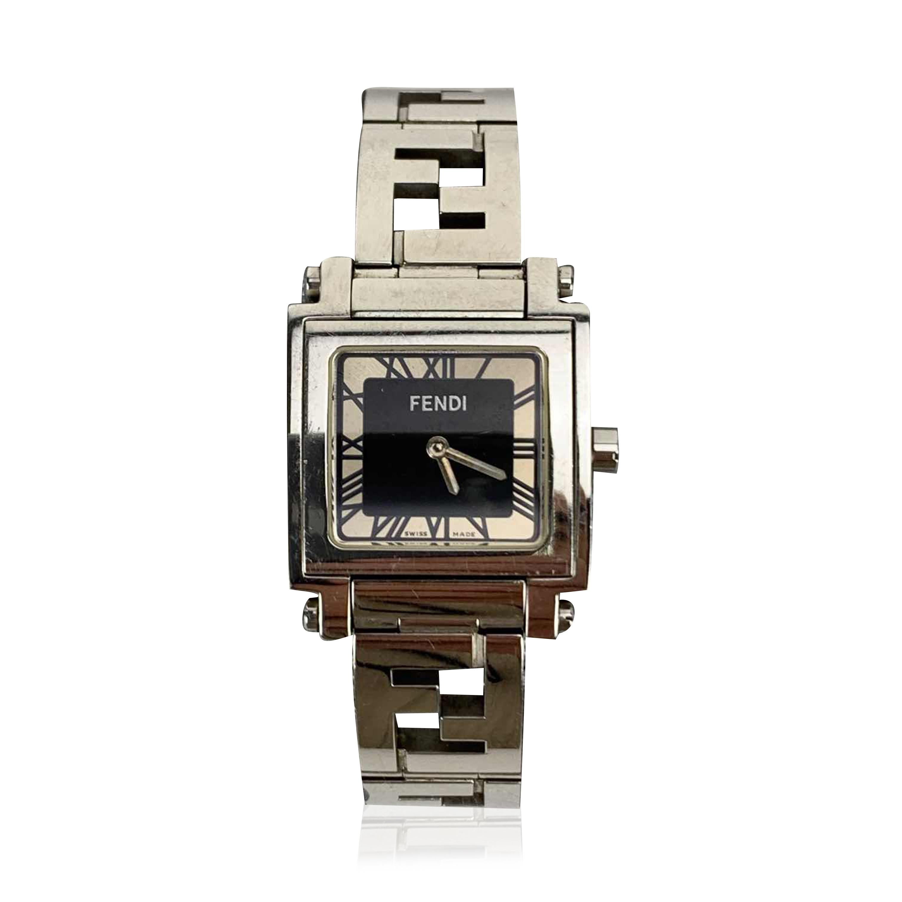 Fendi silver-tone stainless steel watch, Mod. 6000 L. Square stainless steel case. Black dial with roman numbers and two hands. Sapphire crystal. Swiss Made Quartz movement. Fendi written on face. Silver-tone wrist strap with FF logos. .Deployant