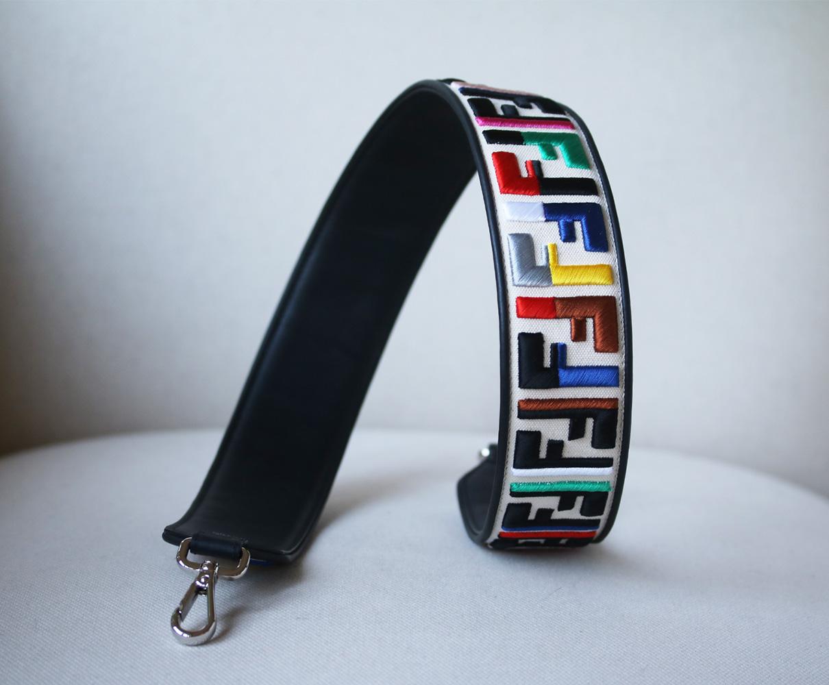 Fendi's strap is appliquéd with the colour-blocked embroidered versions of the house's iconic double 'F' logo. It's made from supple leather and canvas. Multicolored embroidery, ivory canvas and black leather (Calf). Lobster clasp fastenings. Made