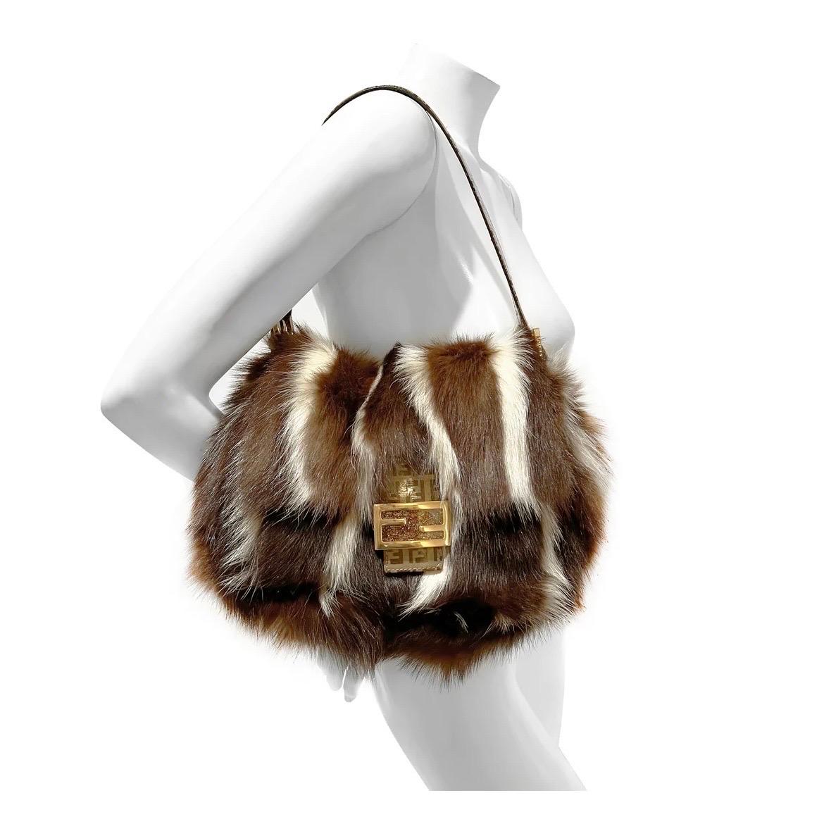 Fendi Two-tone Striped Skunk Fur Handbag
Circa 2000s
Made in Italy 
Skunk fur
Brown and cream stripe
Bag has FF gold  buckle with glitter detail and magnetic closure
Gold hardware
Strap is adjustable with FF logo pattern and dual gold