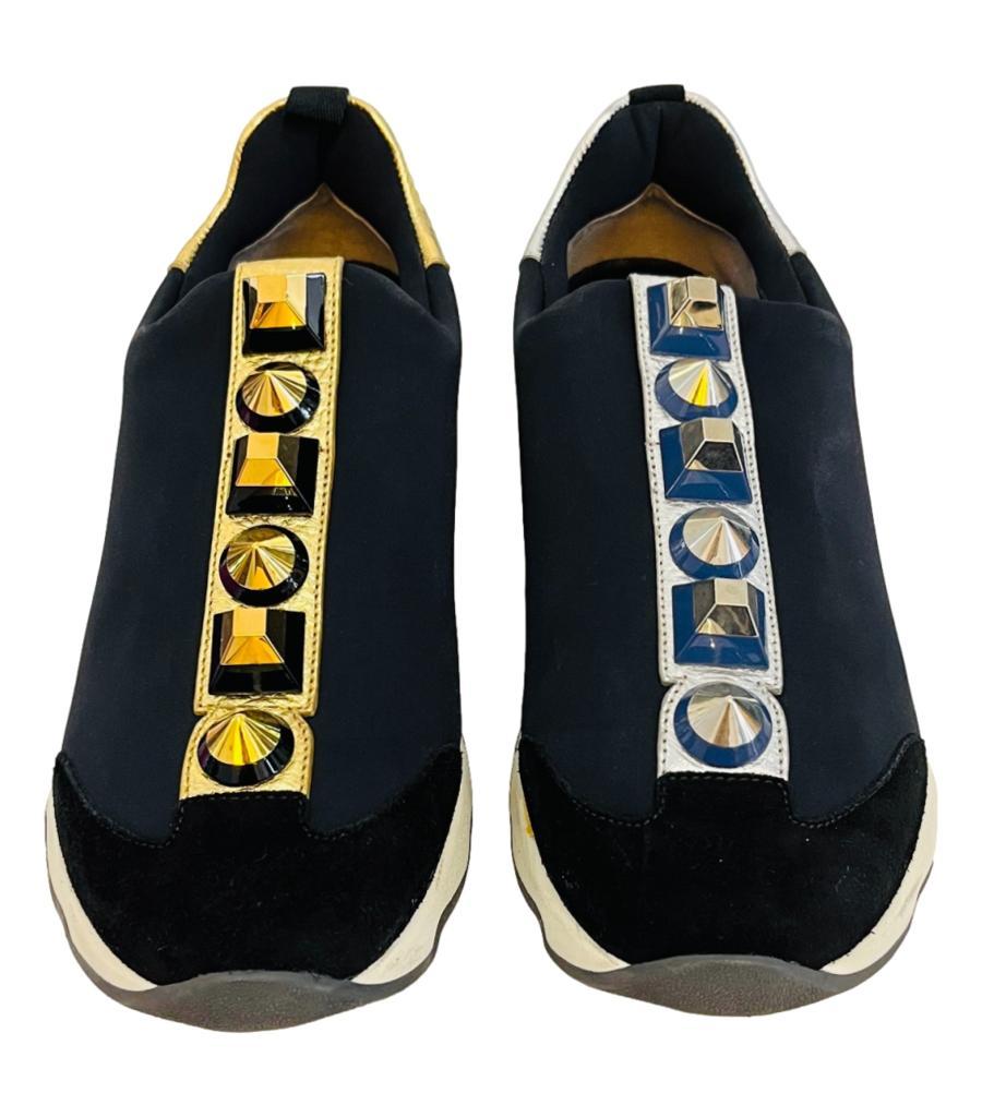 Fendi Stud Embellished Slip-On Sneakers

Black sneakers crafted in neoprene and suede, embellished with oversized studs on a metallic leather strap in gold to one shoe and silver to the other.

Featuring white chunky midsoles, leather insoles and