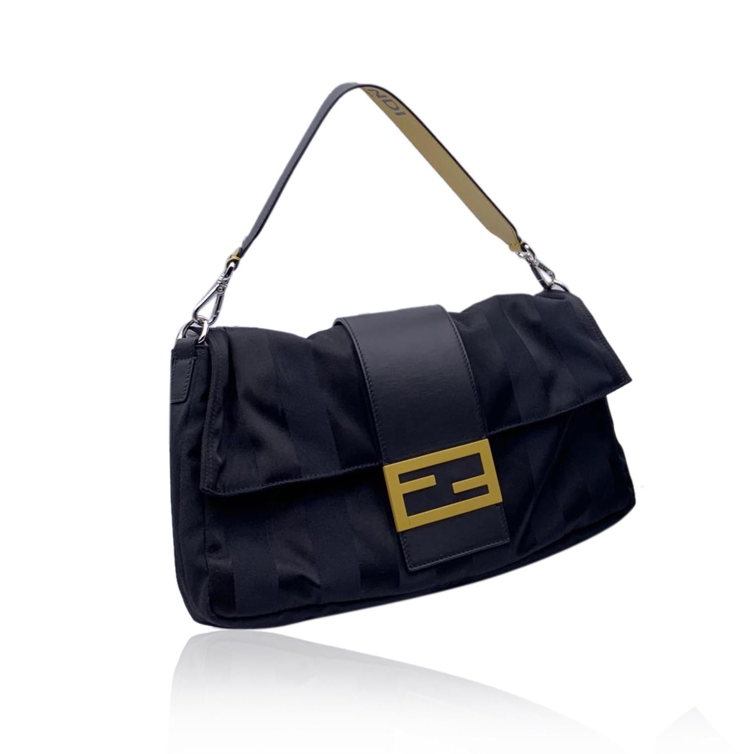 This beautiful Bag will come with a Certificate of Authenticity provided by Entrupy, The certificate will be provided at no further cost.

Fendi 'Baguette Large' bag crafted in black Pequin canvas with genuine leather strap in black and yellow