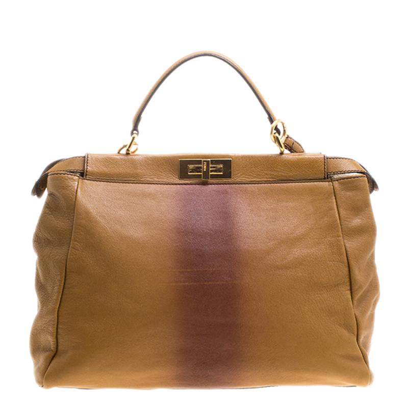 Fendi's Peekaboo collection is the most recognisable. Crafted from ombre leather the bag features a top handle, a shoulder strap and protective metal feet at the bottom. A turn lock closure opens to a suede and calfhair lined interior that will hold