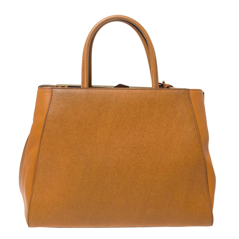 Fendi's 2Jours tote is one of the most iconic designs from the label and it still continues to receive the love of women around the world. Crafted from tan leather, the bag features double rolled handles. It is also equipped with a fabric interior