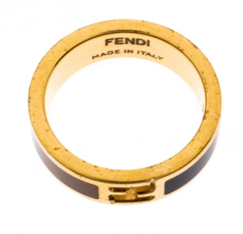 This classy and elegant The Fendista ring by Fendi is made with gold-tone metal and is coated with two-tone enamel. It features the Fendi logo cutout at the center. Simple and distinctive, this ring deserves to be yours.

