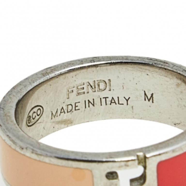 This classy and elegant The Fendista ring by Fendi is made with silver-tone metal and is coated with two-tone enamel. It features the Fendi logo cutout at the center. Simple and distinctive, this ring deserves to be yours.