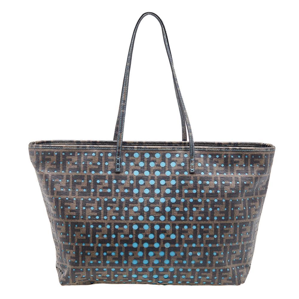 You don’t have to worry about things missing or falling with this Spalmati tote from Fendi. Made from perforated Zucca canvas, this tote features a blue underlay, two flat handles, and a top zip closure. The fabric-lined interior is meant to carry