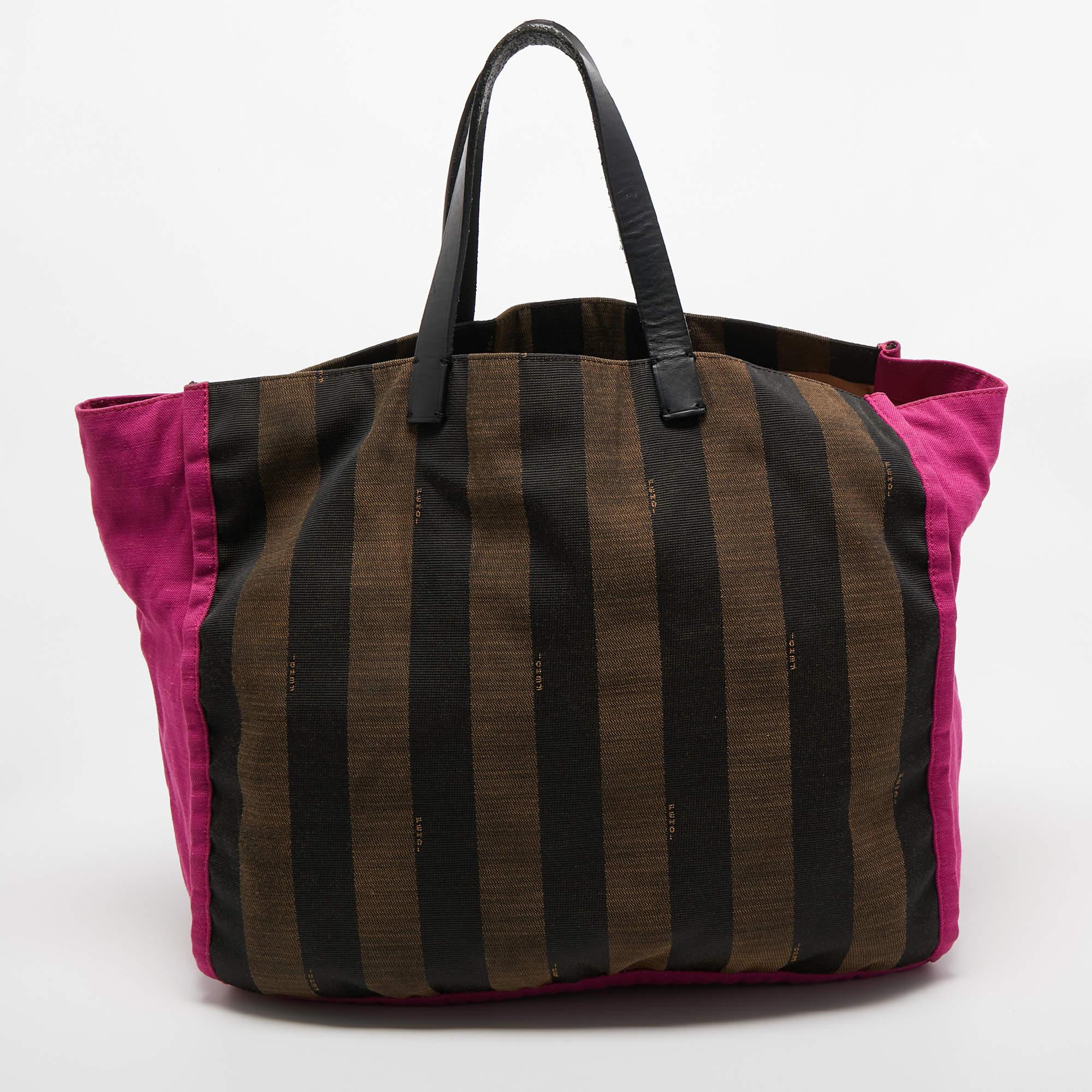 This tote is a result of blending high crafting skills with a practical design. It arrives with a durable exterior completed by luxe detailing. It is an accessory that you can count on.

Includes: Slim Pouch