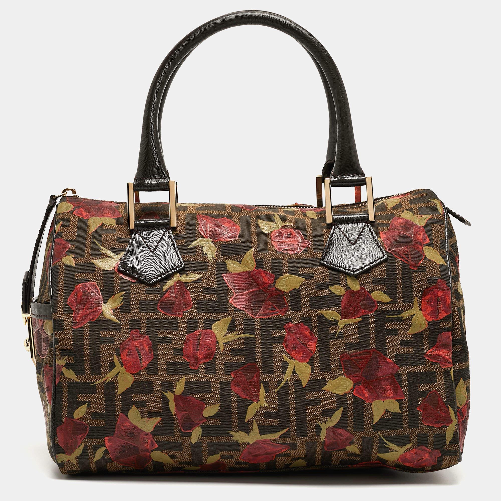This Zucca Chef medium Boston will remain forever chic. Crafted from Fendi’s classic Tobacco Zucca canvas with rose prints and patent leather trim, the exterior is accented with a unique zip keeper. The interior is lined with fabric and has enough