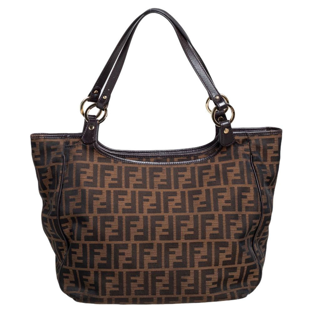 Win praises every time you swing this classic Chef shopper tote. While the inner fabric is well-fitted, the Zucca canvas and leather exterior truly speak Fendi. It is a timeless investment. Carry this instantly-recognizable Fendi creation and be in