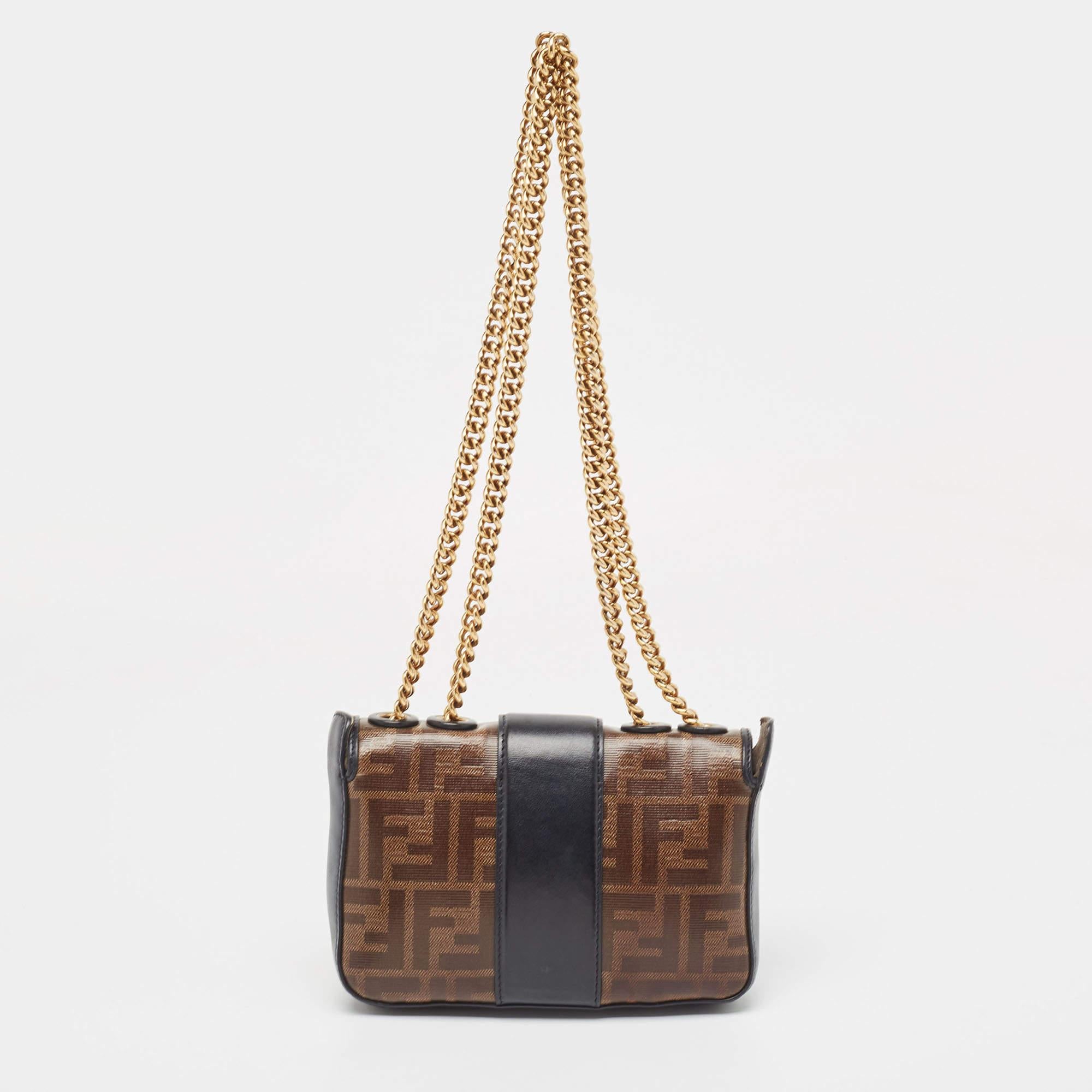 Imbued with signature elements, this Fendi Mini 1974 bag will be a valuable addition to your closet. The usage of the Zucca coated canvas in the construction and the addition of a branded accent on the front flap give a luxurious look.

Includes:
