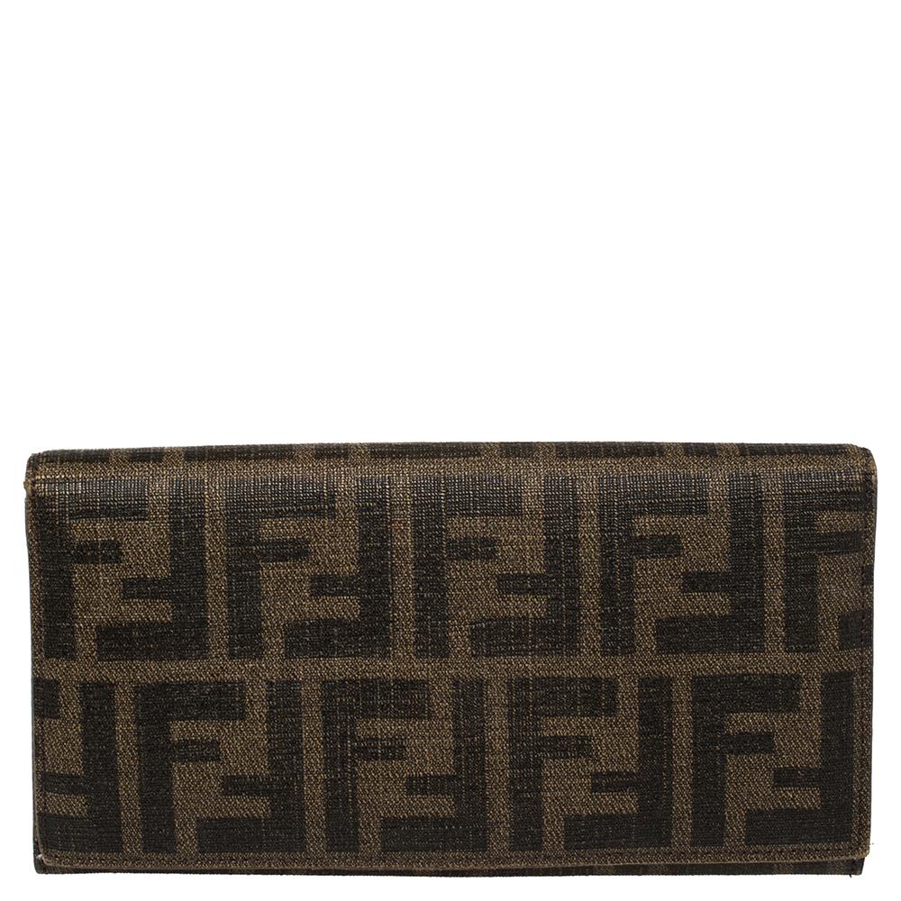 The legacy of Fendi continues with stylish products from the label such as this wallet. It features the iconic Zucca canvas exterior, and the flap opens to a leather-nylon lined interior with a zipper pocket and multiple compartments for your