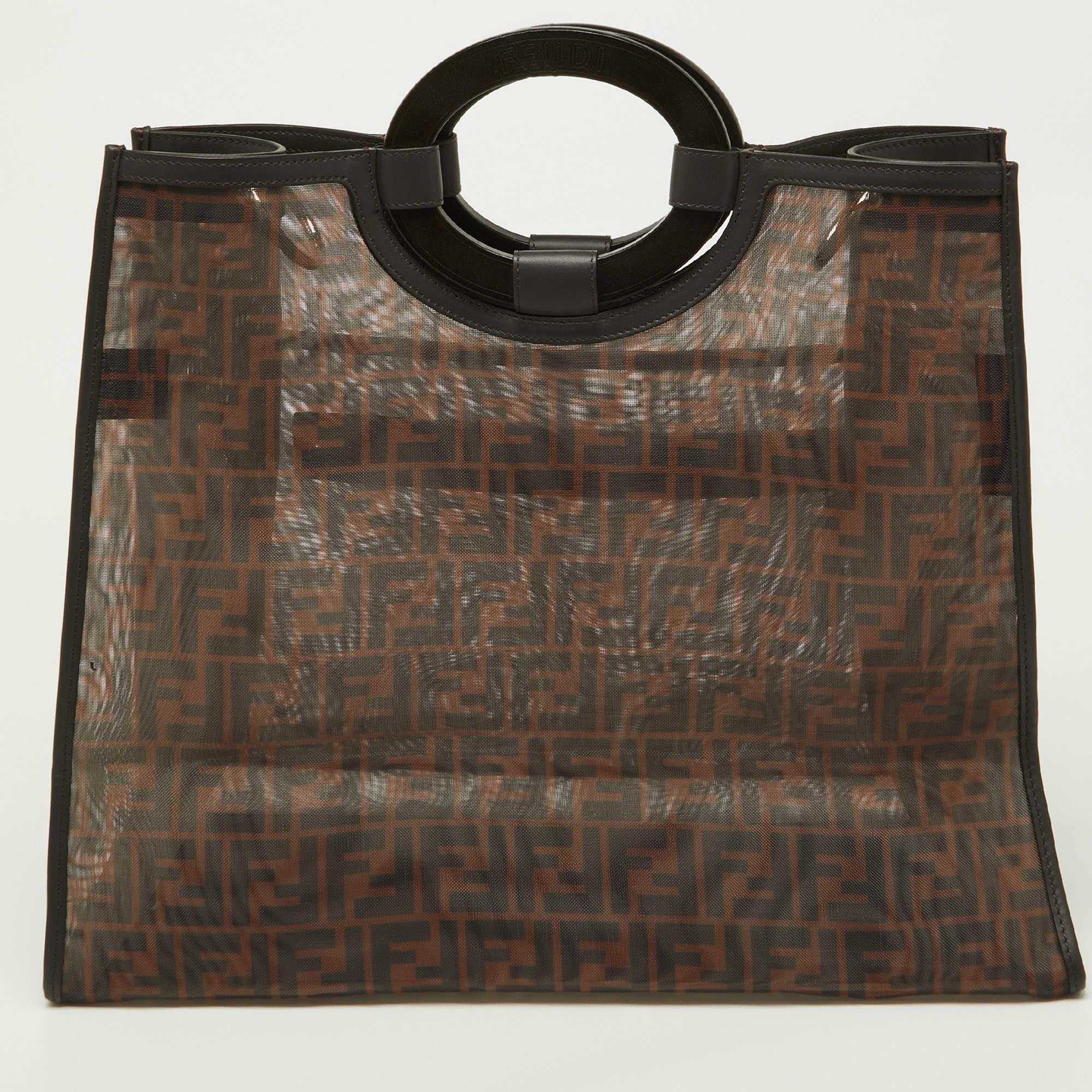 This Fendi Runaway shopper tote is sure to grab you never-ending compliments! It is crafted from tobacco Zucca mesh and features dual top handles, silver-tone hardware, and a front zip pocket. It opens to a spacious interior that can easily store