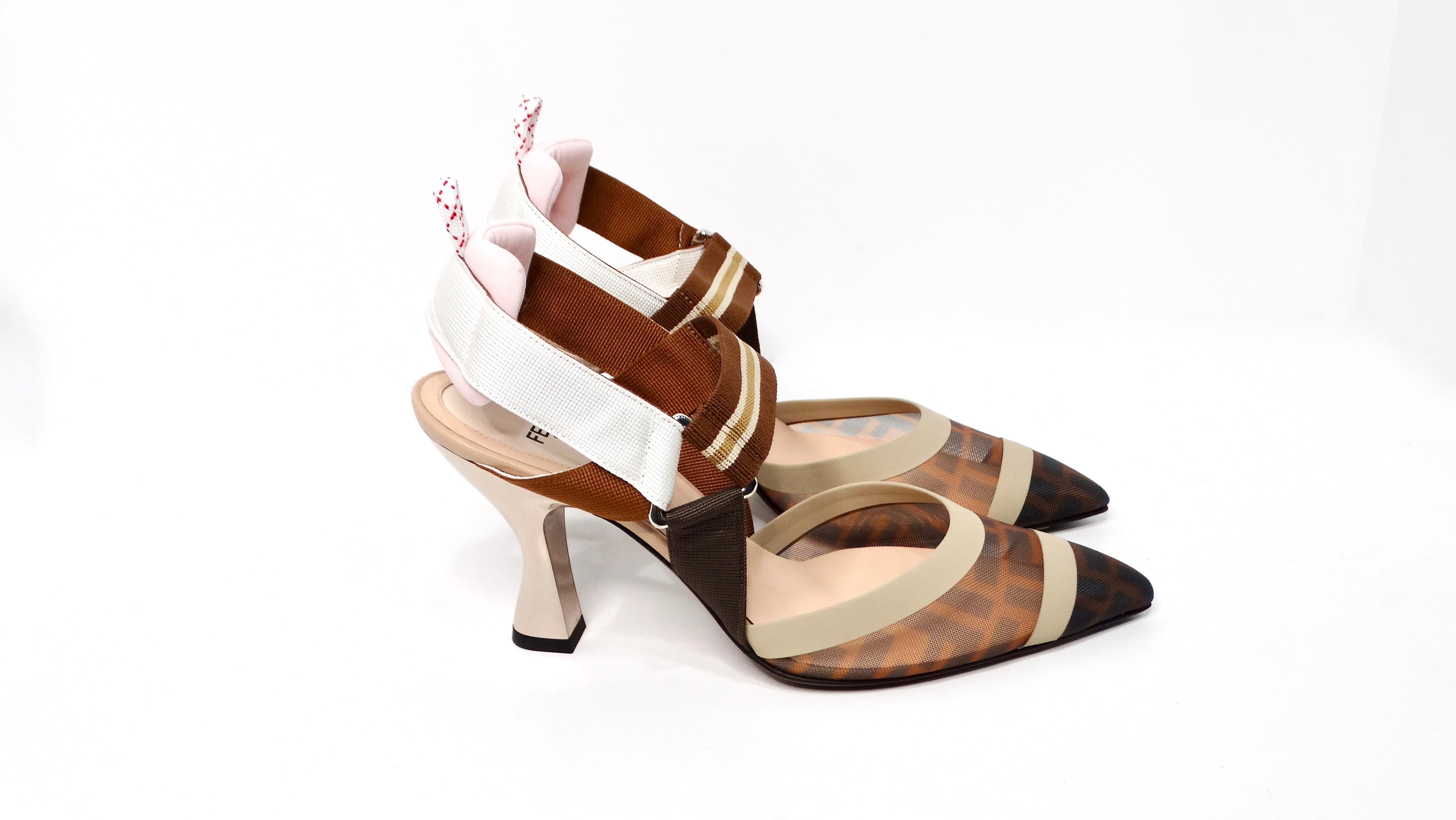 Step into the realm of avant-garde fashion with the Fendi Tricolor Zucca Mesh & Leather Colibri Heels. These striking pointed-toe pumps boast a unique blend of sophistication and modernity. The upper features a captivating brown tricolor Zucca mesh