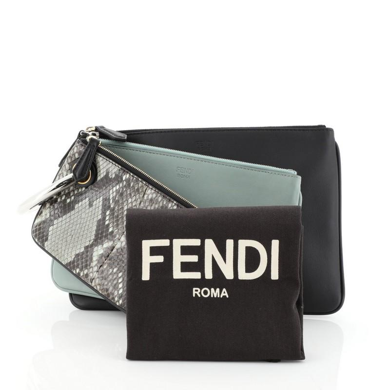 This Fendi Triplette Pouch Set Python, crafted in genuine black and green leather and python skin, features a Fendi logo ring clip handle and silver-tone hardware. Its zip closures open to a black fabric interior. This item can only be shipped