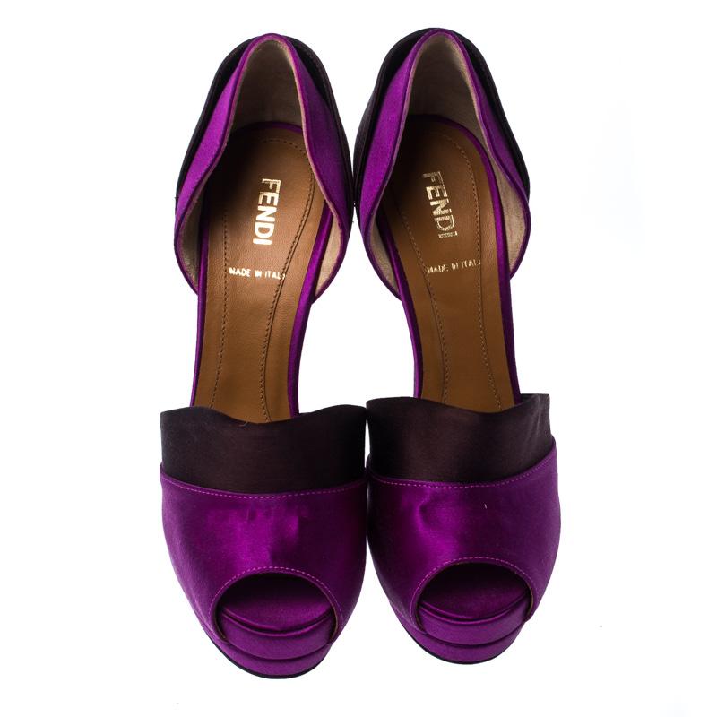 Fendi brings you these purple Anemone pumps to make you look very stylish and absolutely stunning! These pumps are crafted from satin and feature an impressive silhouette with a D'orsay style and peep-toes. They come equipped with leather-lined