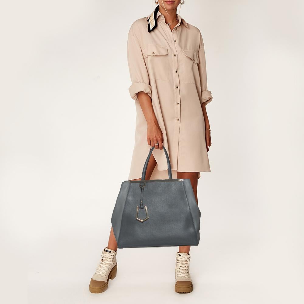 Fendi's 2Jours tote is one of the most iconic designs from the label and it still continues to receive the love of women around the world. Crafted from two-toned grey leather, the bag features double-rolled handles. It is also equipped with a fabric