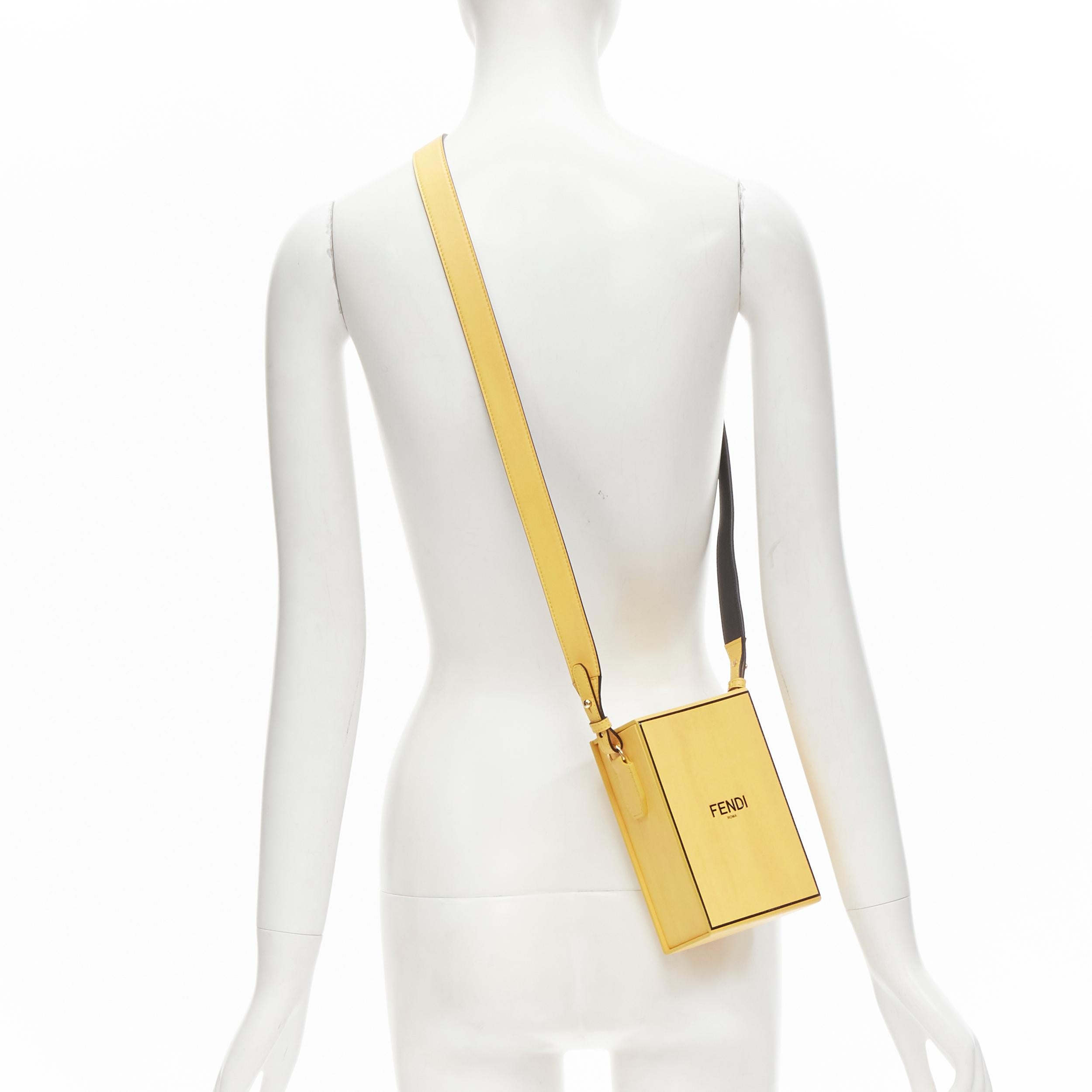 FENDI Vertical Box signature yellow black crossbody structured bag 
Reference: ANWU/A00054 
Brand: Fendi 
Model: Vertical Box 
Collection: 2020 
Material: Leather 
Color: Yellow 
Pattern: Solid 
Closure: Magnet 
Extra Detail: Inspired by a Fendi