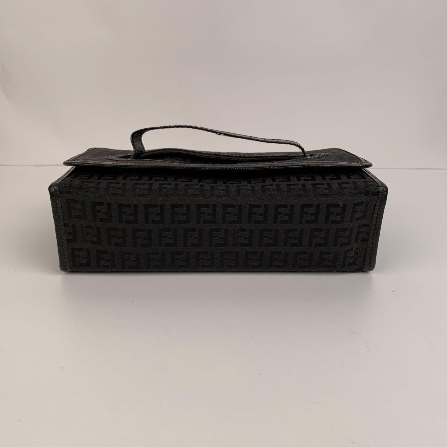 Beautiful vintage Fendi cosmetic case, crafted in black FF monograms canvas with genuine leather trim. Top carry handle and upper hook and loop closure. It can be used also as a travel jewelry case. 'Fendi s.a.s Roma - made in Italy' embossed
