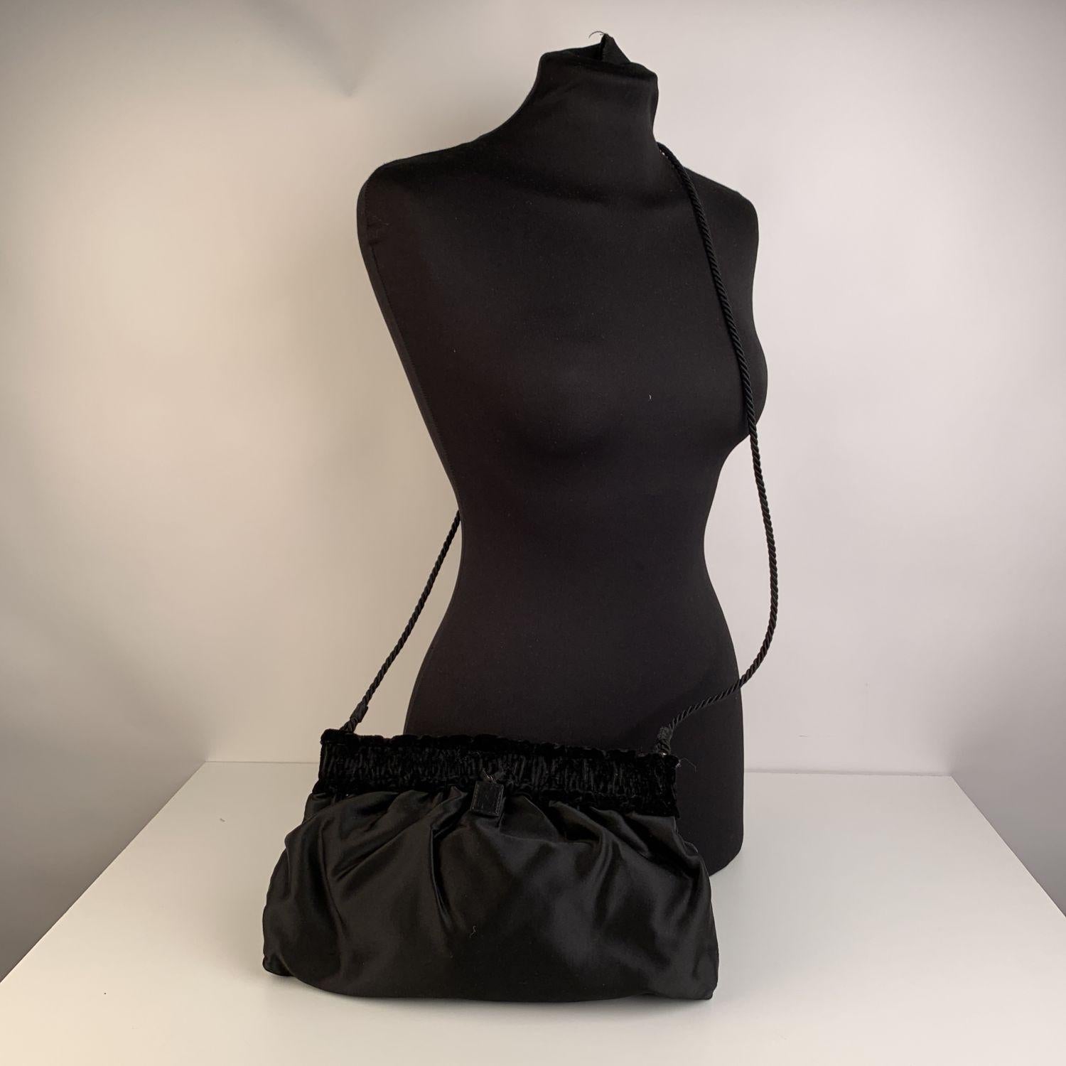 Vintage Fendi crossbody evening bag crafted in black satin with black velvet trim. Black satin lining. 1 side zip pocket inside. 'Fendi Roma - Made in Italy' tag inside.





Details

MATERIAL: Satin

COLOR: Black

MODEL: Crossbody Bag

GENDER: