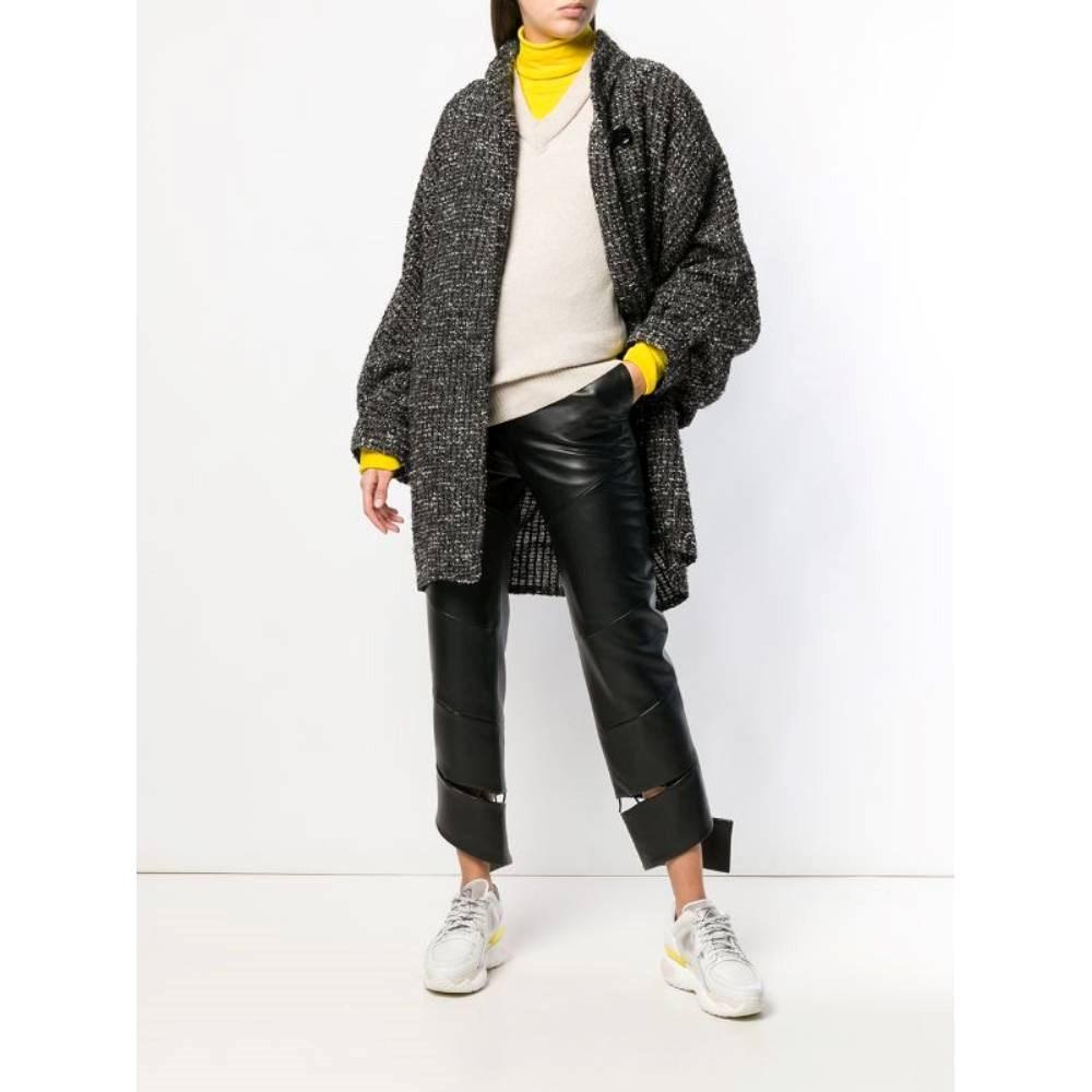 Fendi black, white and grey bouclé wool 80s long cardigan with mandarin collar, batwing sleeves and a frontal button fastening.

Size: 42 IT

Flat measurements
Height: 102 cm
Bust: 64 cm
Sleeves: 73 cm
Shoulders: 46 cm

Product code: