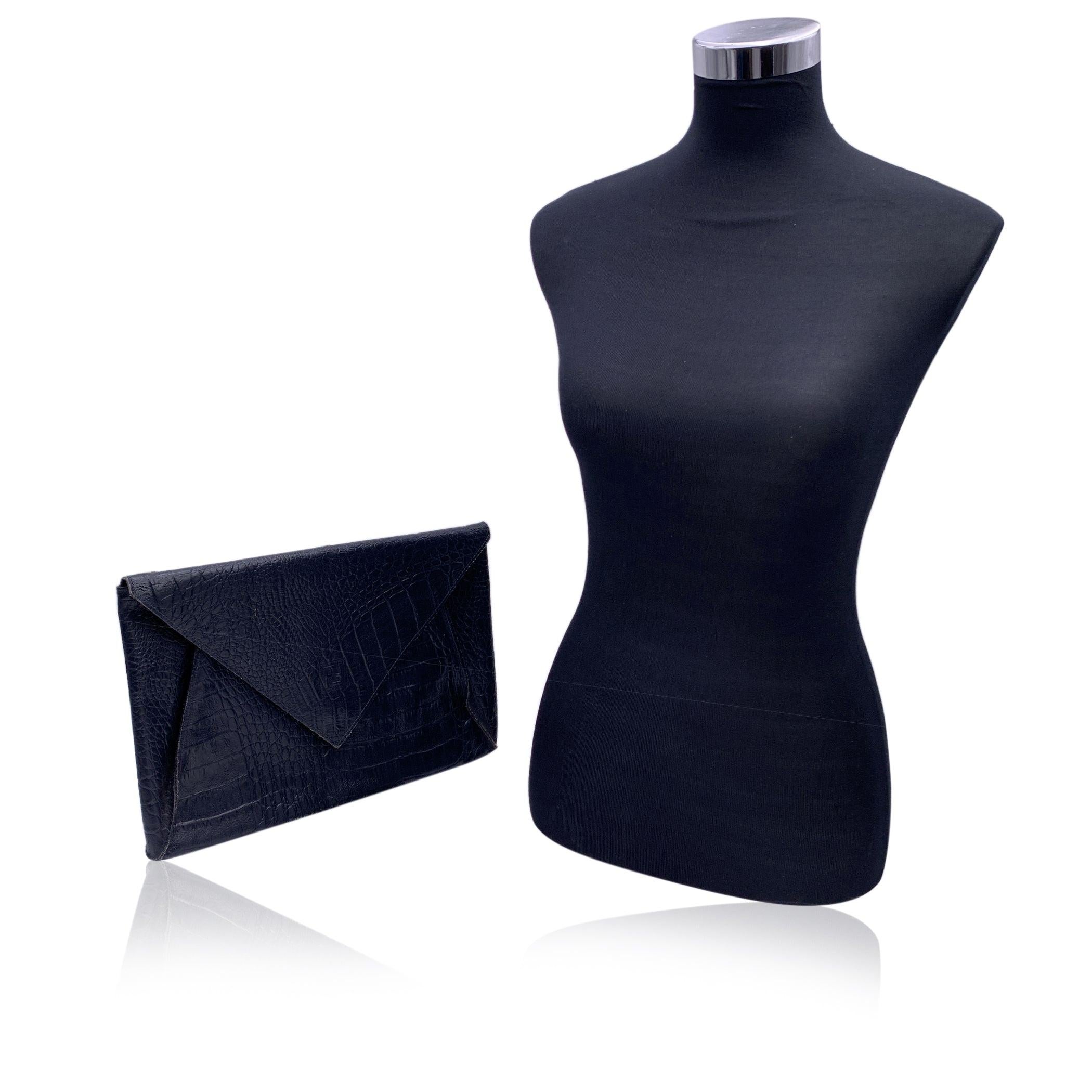 Vintage FENDI Porfolio/clutch bag from the 80s. Crafted in blue leather with embossed crocodile look. Flap with magnetic button closure. FF - Fendi logo on the front, Signature fabric lining. 1 side zip pocket inside. 'Fendi s.a.s. Roma - Made in