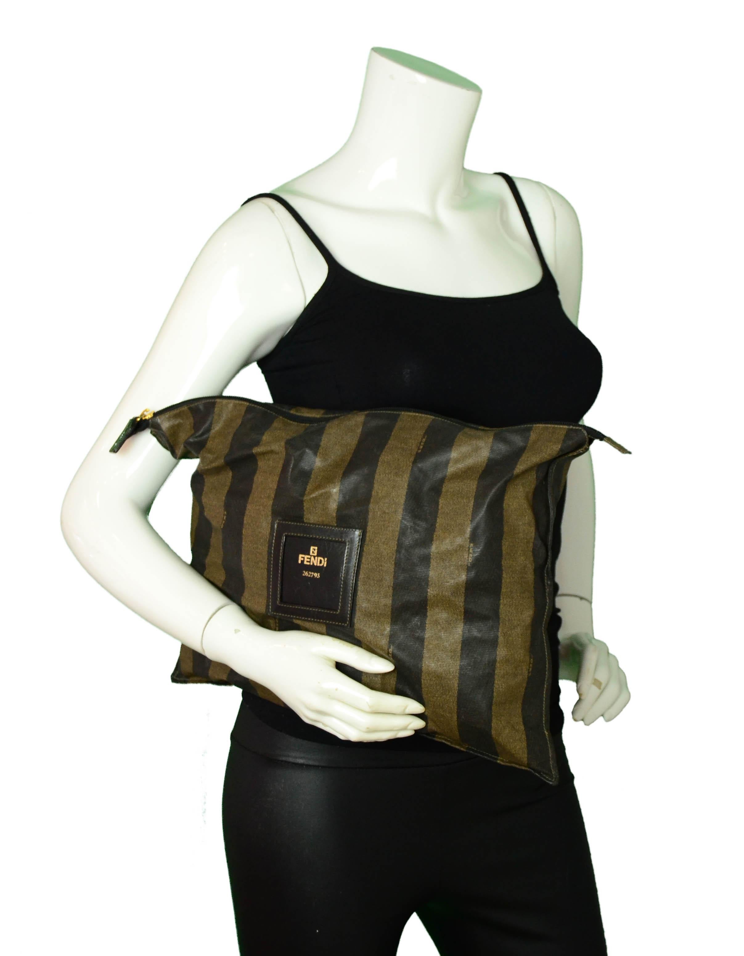 Fendi Vintage Brown Pequin Striped XL Zip Top Pouch Clutch

Made In: Italy
Color: Brown
Hardware: Goldtone
Materials: Coated Nylon/Leather
Lining: Nylon
Closure/Opening: Zip top
Exterior Condition: Very good - 2 small spots at back
Interior