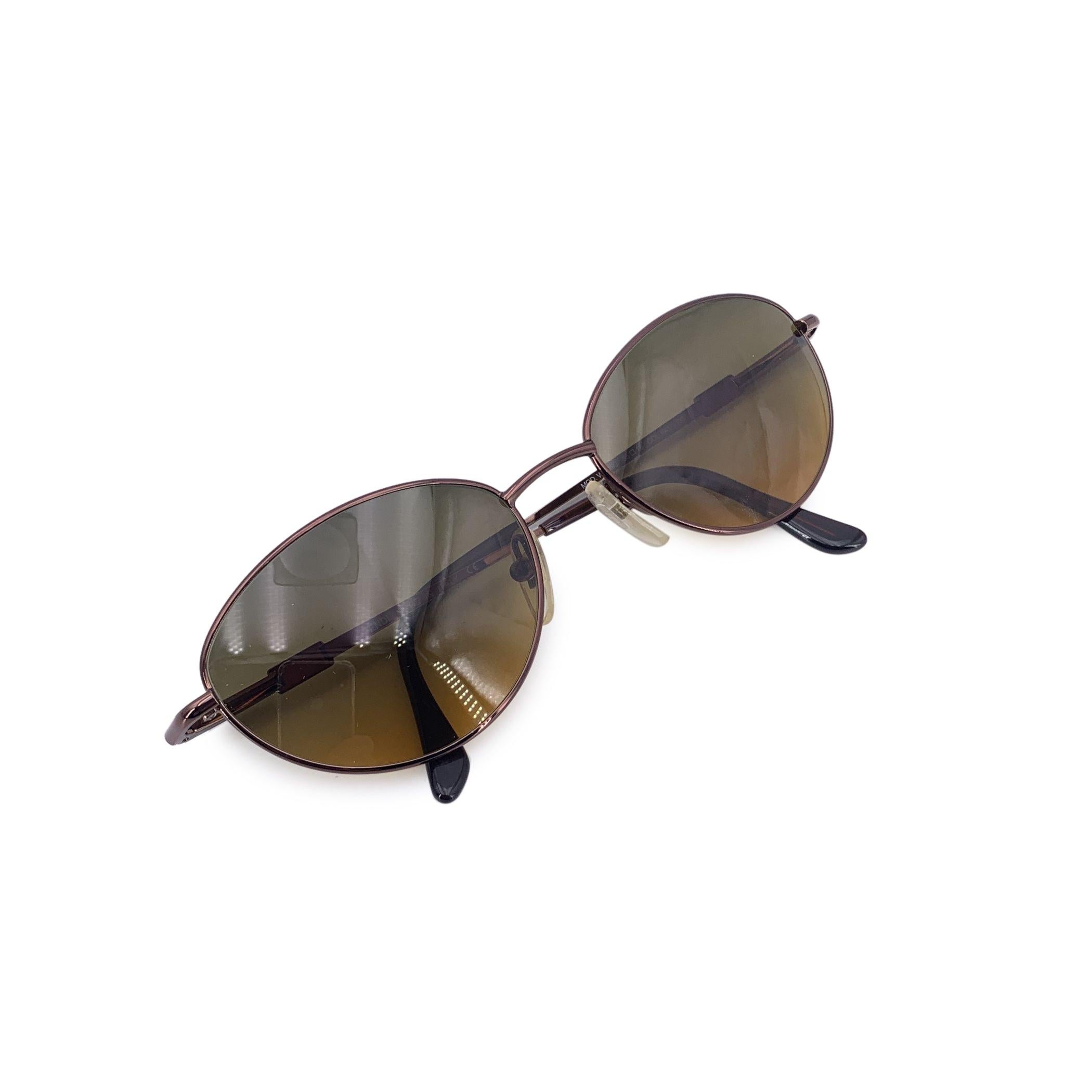 Straight from the sophisticated style playbook of the 1980s, these Fendi vintage brown sunglasses, model VL 7193, are a refined expression of Italian design and everyday glamour. With their soft oval shape and rich brown plastic frame, they carry