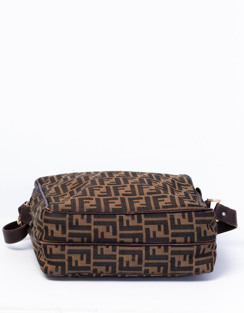 Vintage Fendi crossbody bag is made with Fendi Zucca monogram canvas. The bag features an adjustable shoulder strap with a leather finishes

COLOR: Brown 
MATERIAL: Canvas
ITEM CODE: Vintage item with no code.
MEASURES: H 12” x L 11” x D