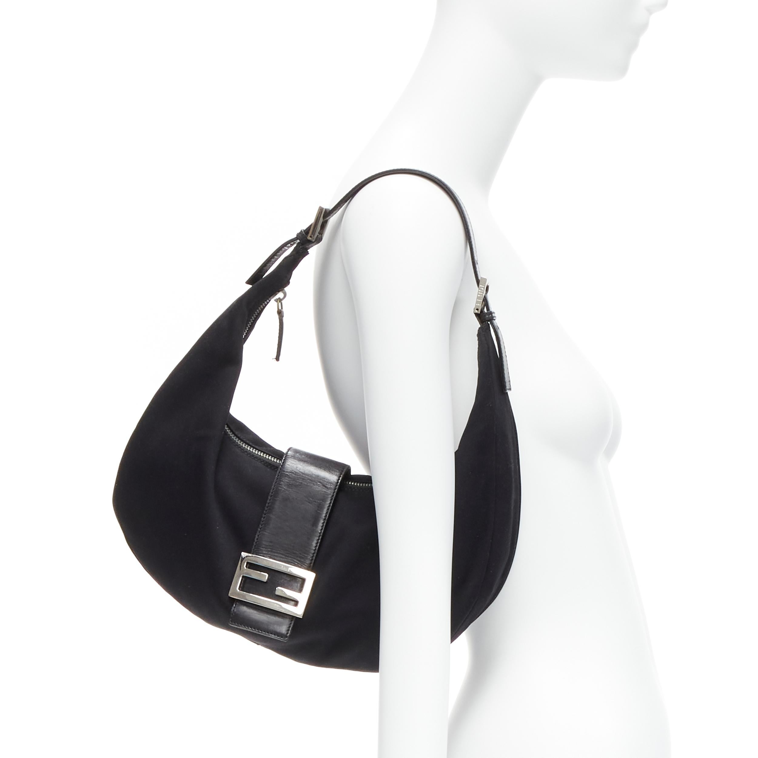 FENDI Vintage Croissant black jersey fabric silver FF logo buckle underarm bag
Reference: TGAS/D00224
Brand: Fendi
Model: Croissant
Material: Fabric, Leather
Color: Black, Silver
Pattern: Solid
Closure: Snap Buttons
Lining: Black Fabric
Extra