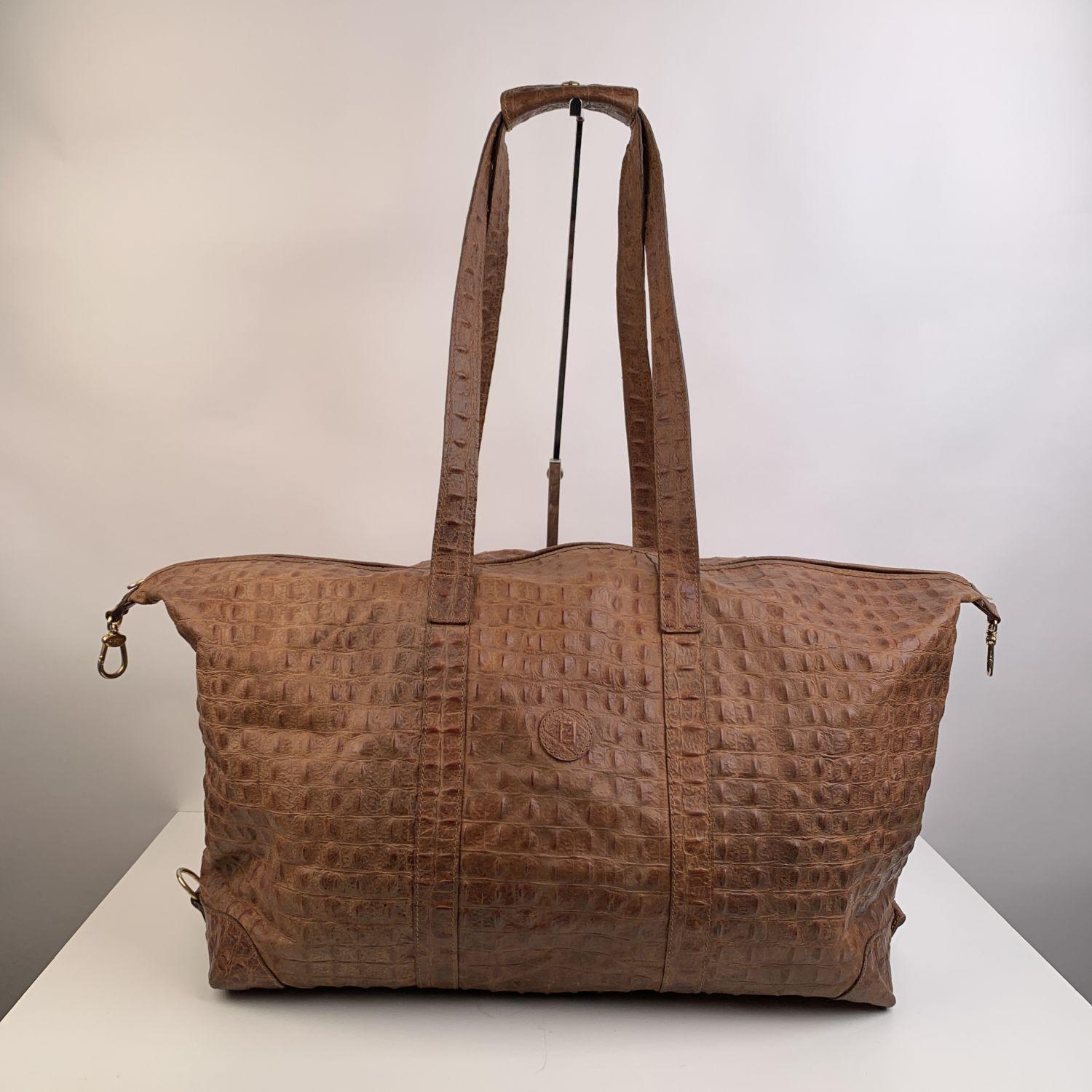 Vintage Fendi embossed croc look Fendi Travel bag / Duffle bag. Light brown leather. FF - FENDI logo patch on the front. Double shoulder strap. Upper zipper closure. 1 side zip pocket inside. 'FENDI s.a.s. Roma - made in Italy' tag