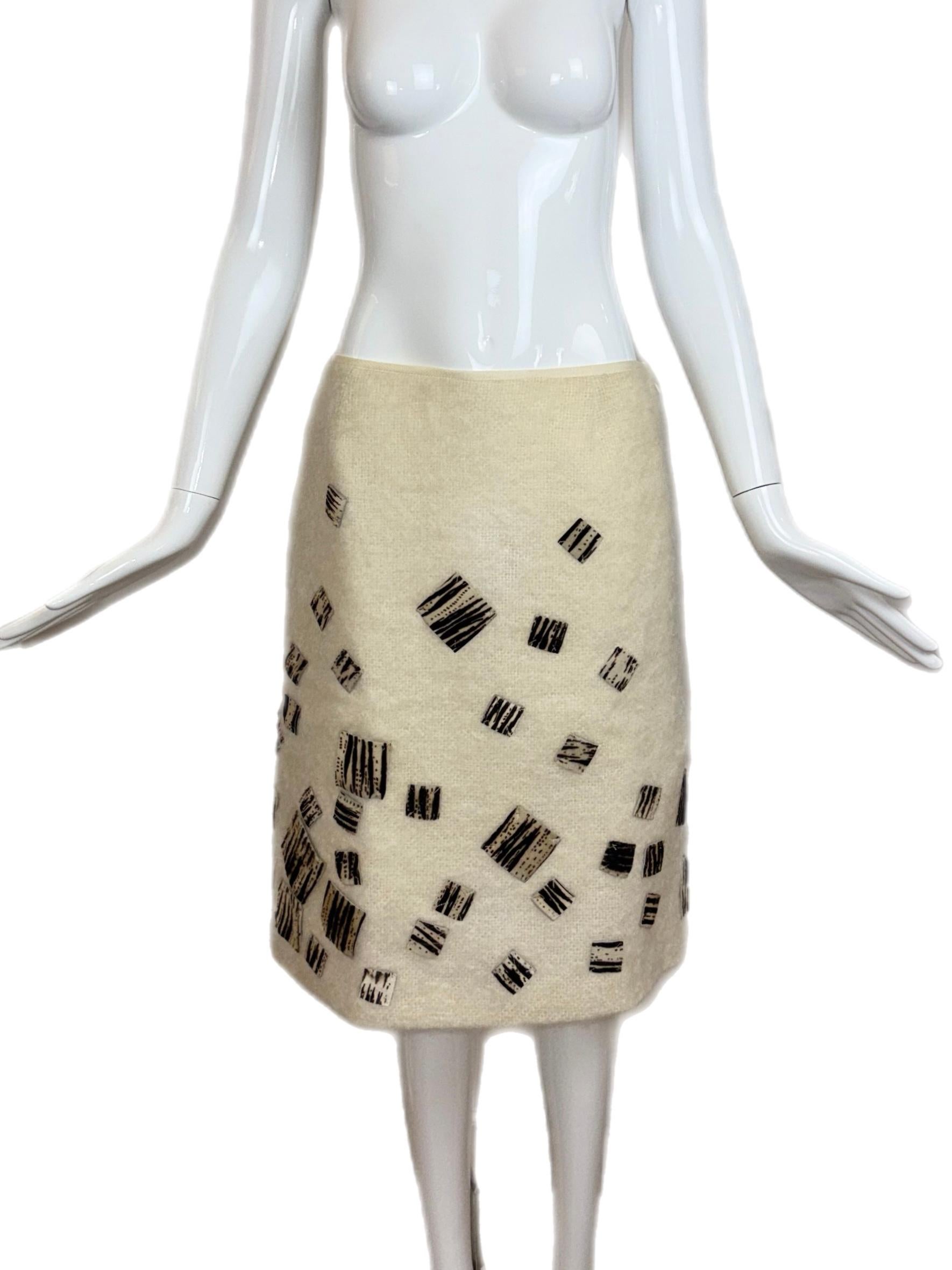 Fendi 365
Vintage
Line created in 1977
Ivory Mohair w. Zebra pony hair patches
Side zipper
Size IT40
This is actually so chic and lays flat against the body
NWT's, has some dark spots (1 on the front, 2 on the back) cannot notice until they are