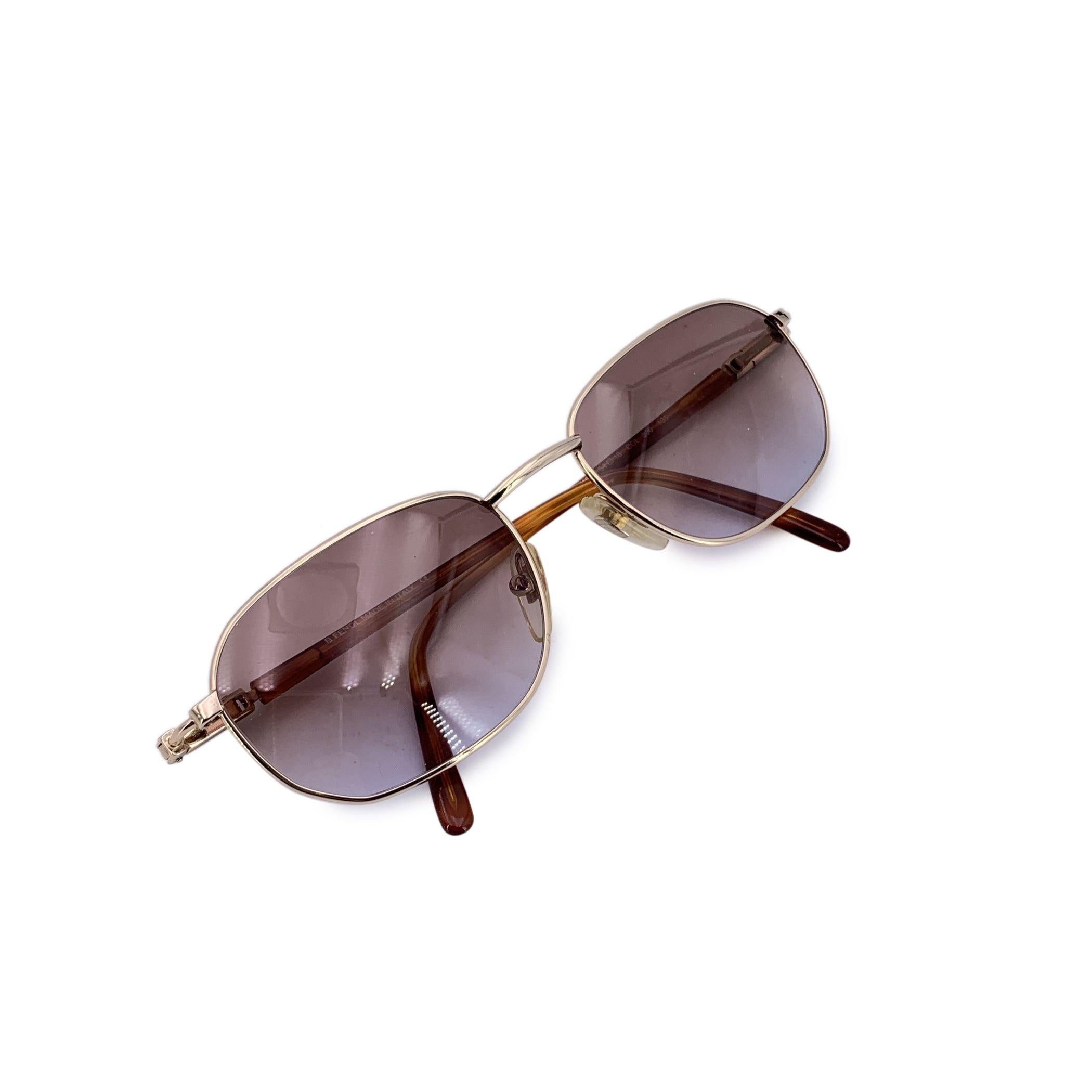 Step into the sophisticated world of 1980s Italian fashion with the Fendi VL 7104 vintage sunglasses-an elegant model that masterfully blends metallic shimmer with earthy charm. Crafted in Italy and designed for women of poise and confidence, this