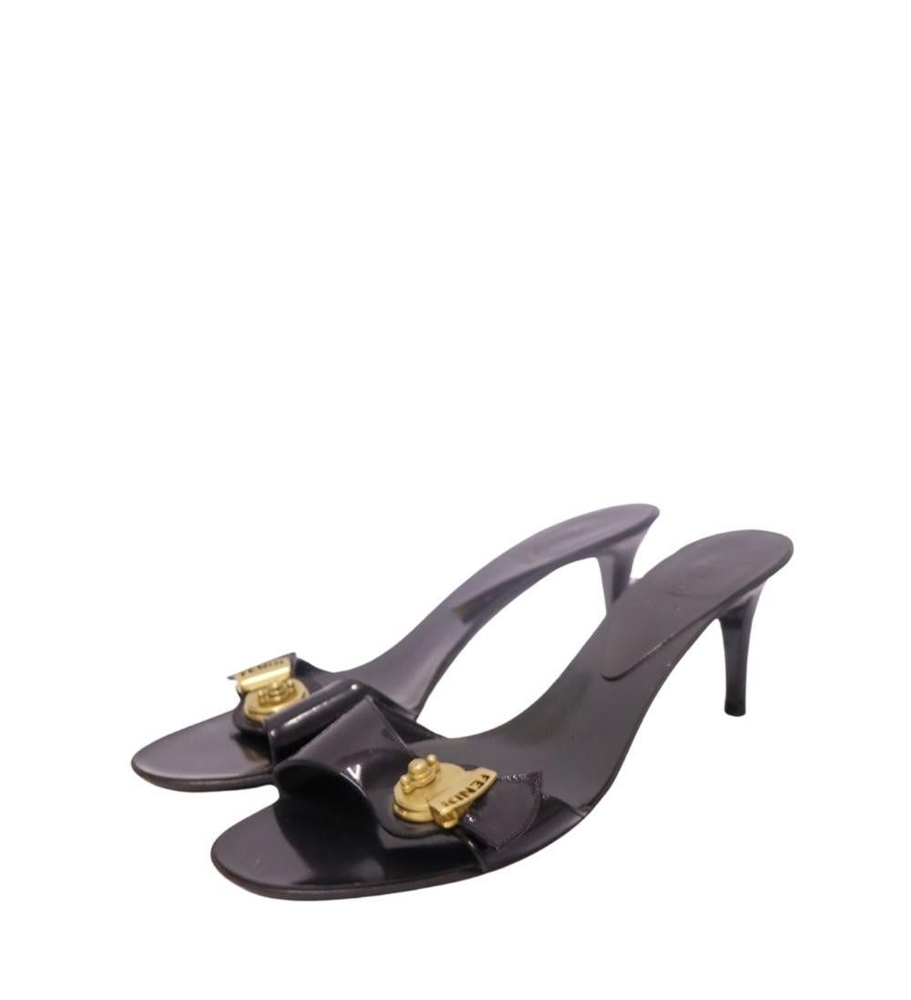 Fendi Vintage Logo Slide, features Logo Plaque, Fendi Detail and 7cm heel.

Material: Leather
Size: EU 38.5
Overall Condition: Good
Interior Condition: Signs of wear
Exterior Condition: Scratches and scuffing