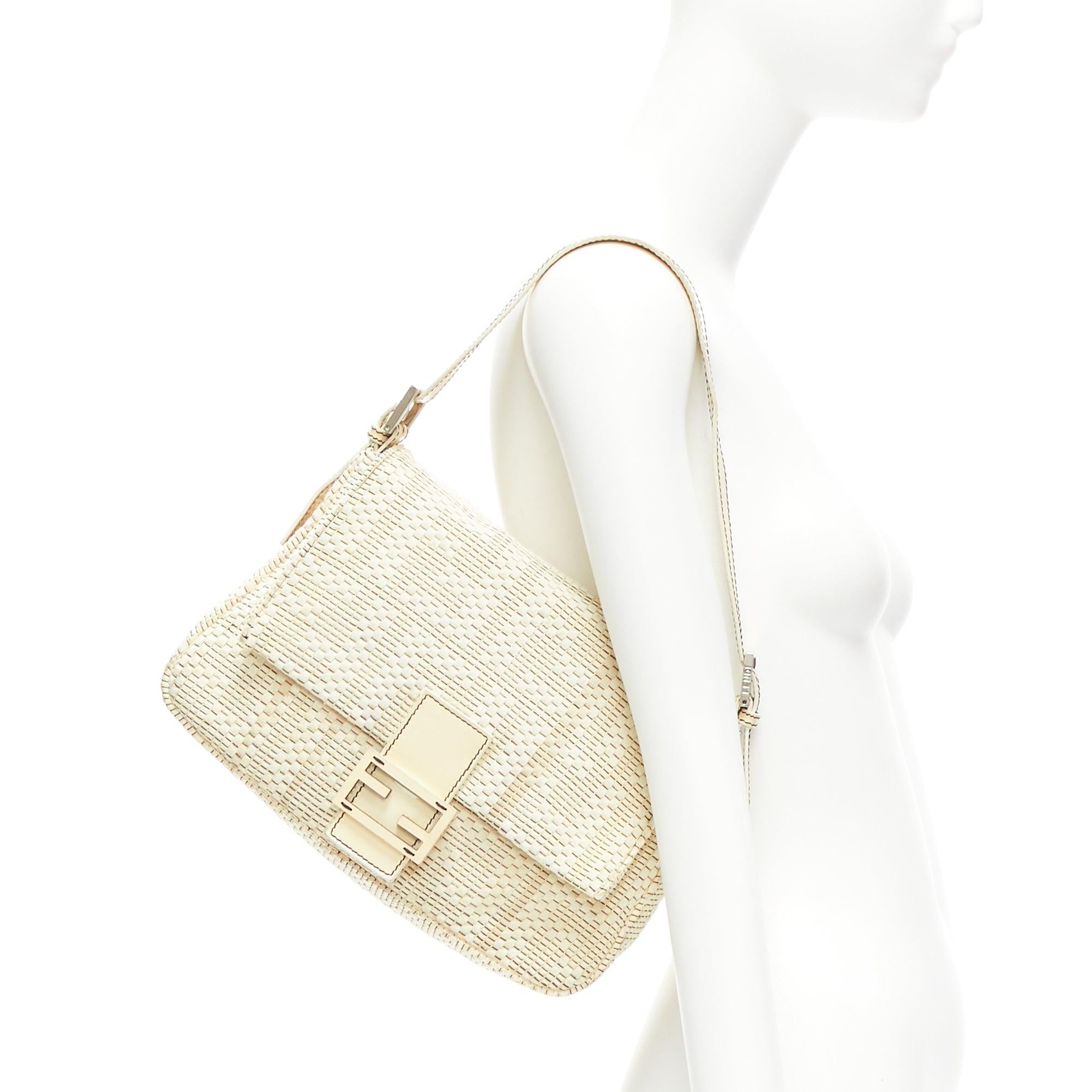 FENDI Vintage Mamma Baguette cream FF Zucca woven fabric underarm bag
Reference: KNCN/A00050
Brand: Fendi
Model: Mamma Baguette
Material: Fabric, Leather, Metal
Color: Cream
Pattern: Solid
Closure: Snap Buttons
Lining: Beige Fabric
Extra Details: FF