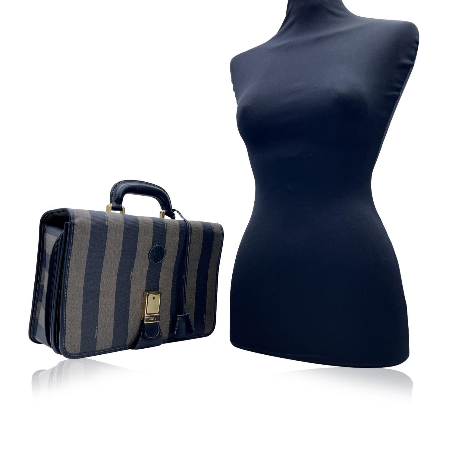 Beautiful Fendi Pequin small briefcase/handbag. Crafted of striped pequin canvas with black leather handle and trim. The bag features a key push closure (key is not included),1 compartment with flap and button closure and 1 large compartment with