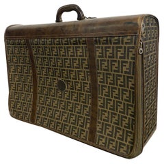 Fendi Vintage suitcase, in logoed canvas and leather parts.