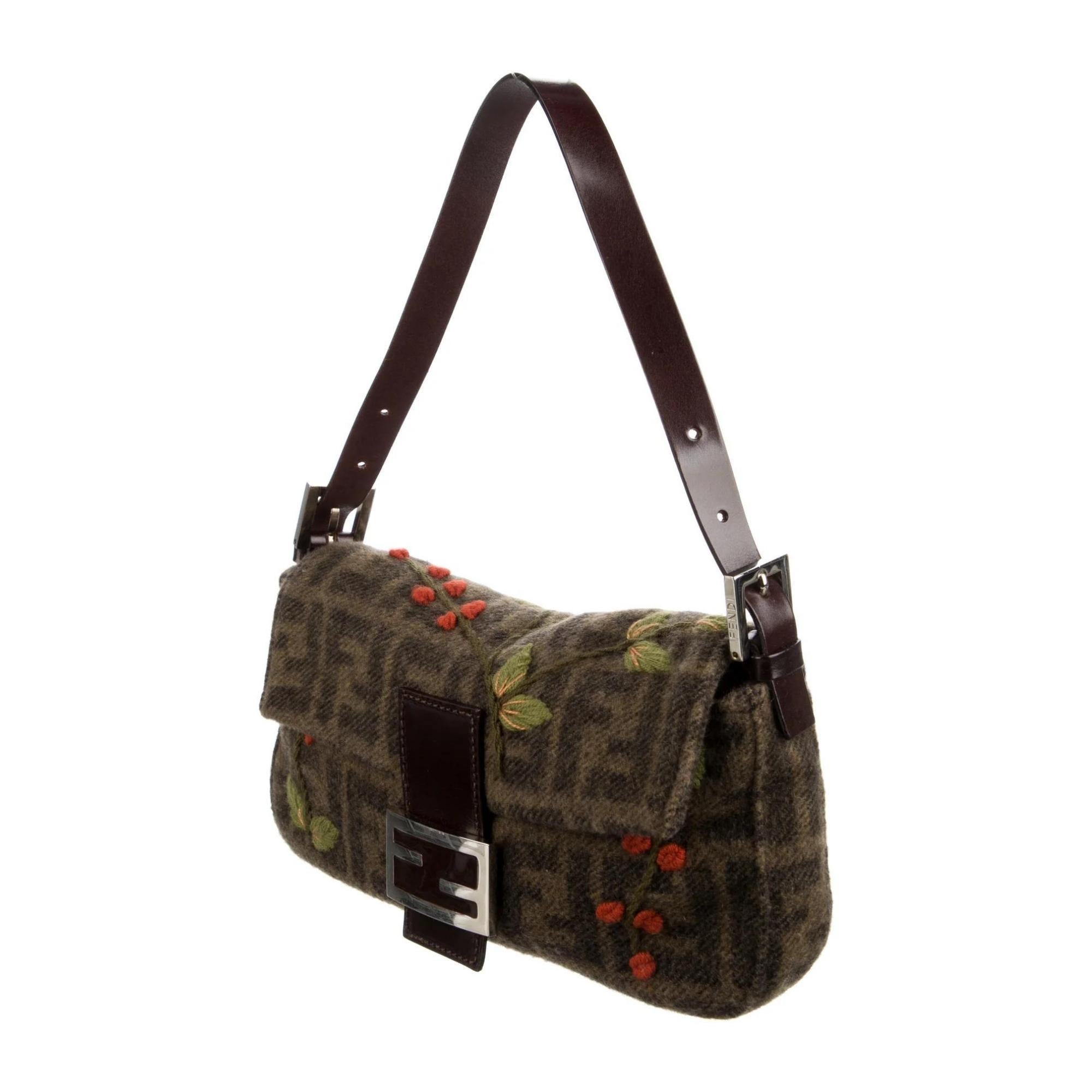 This vintage Fendi shoulder bag is made with wool and cashmere blend in brown. The bag features a printed monogram zucca FF logo throughout, flower embroidery, silver-tone hardware, a single flat leather shoulder strap, a front flap with snap