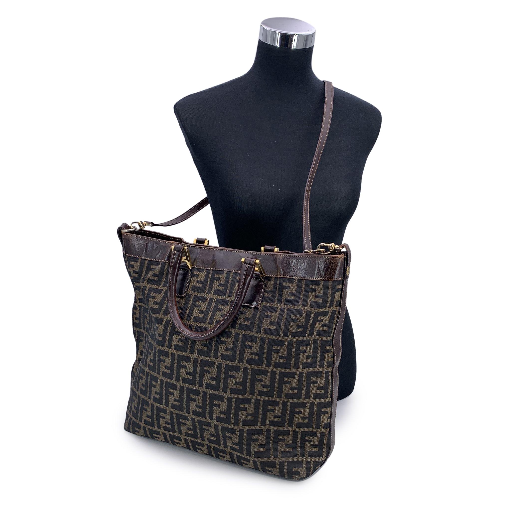 Step into the timeless elegance of Italian fashion with this stunning Fendi Zucca tote bag in the classic tobacco colorway. A true emblem of the house's heritage, the bag is crafted in the iconic FF monogram Zucca canvas-a pattern designed by Karl