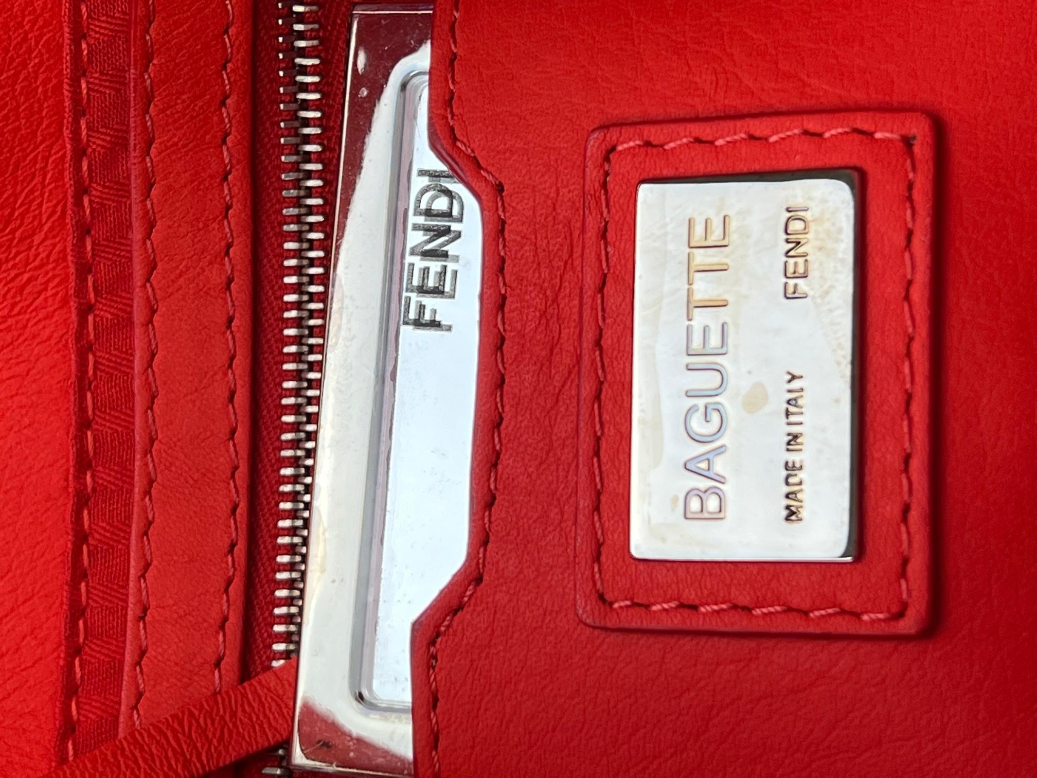 Pre-Owned 100% Authentic
Fendi Vitello Baguette Papavero Bag
RATING: A   excellent, near mint, has little
to no signs of wear
MATERIAL: leather
STRAP: Fendi long adjustable leather
strap 53.5 in long
DROP: 19 in to 24 in
HANDLE: adjustable leather