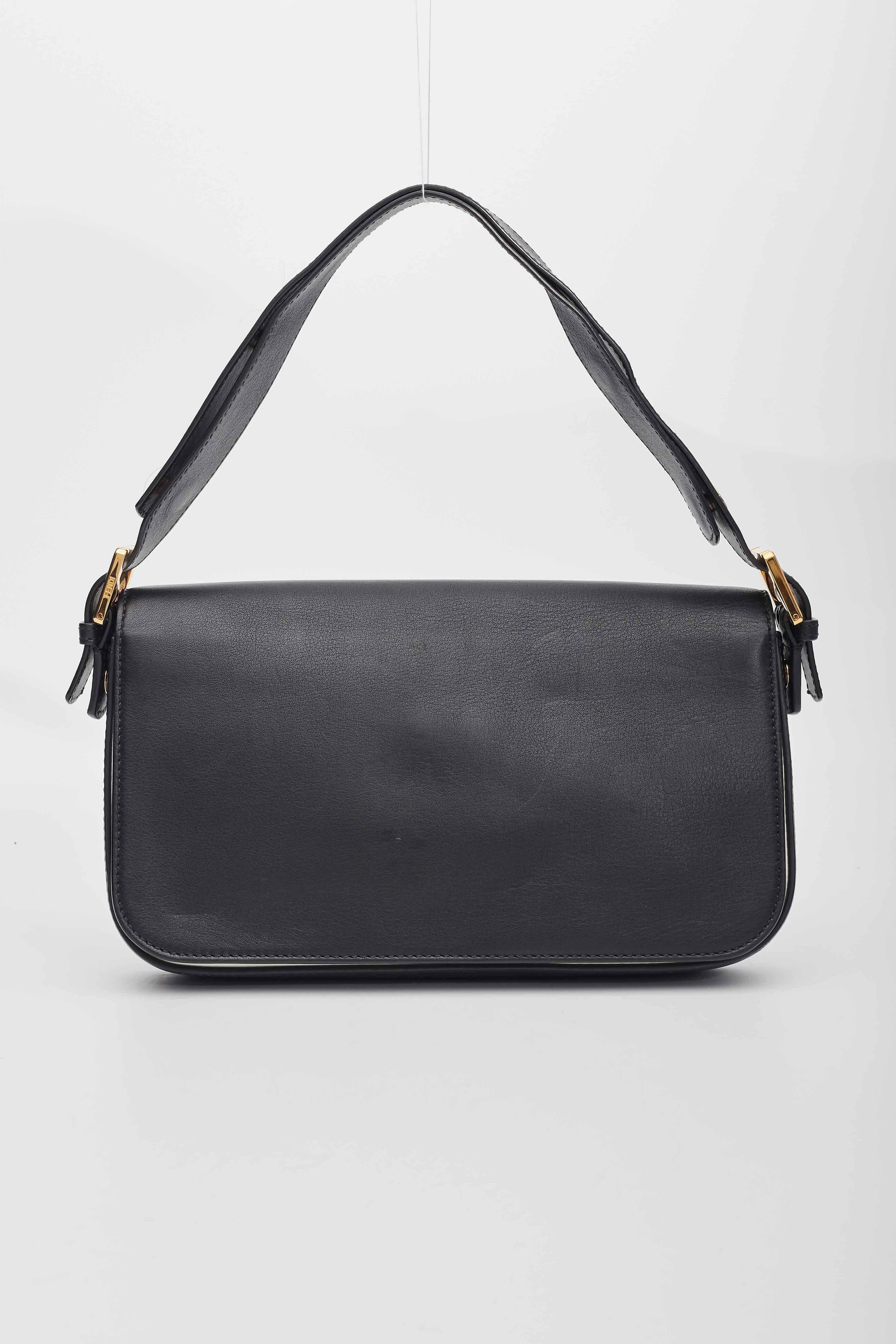 This bag is crafted of calfskin leather in black. This bag features an adjustable shoulder strap and gold and white Fendi logo. The flaps open to a fabric interior. T

Color: Back
Material: Calfskin leather
8BR720

Length: 10.50 in
Width: 2.00
