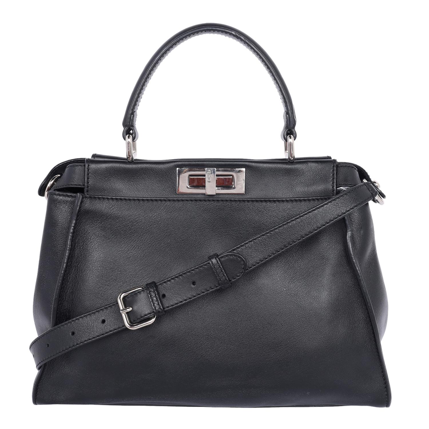 Authentic, pre-loved Fendi Vitello Seta Crocodile Monster Eyes Medium Peekaboo Iconic Satchel in black. Features soft calfskin leather in black with side belts and expandable sides, top handle, adjustable crossbody strap, silver hardware, turn lock