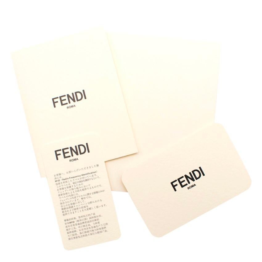 Fendi Vocabulary 3D Logo Calfskin Flat Pouch

-Smooth Calfskin white body
- Layered 3D logo & patch in black, charcoal & taupe
- Zip Top closure
- Fully lined in a cotton blend
- Dust bag & Box included

Please note, these items are pre-owned and