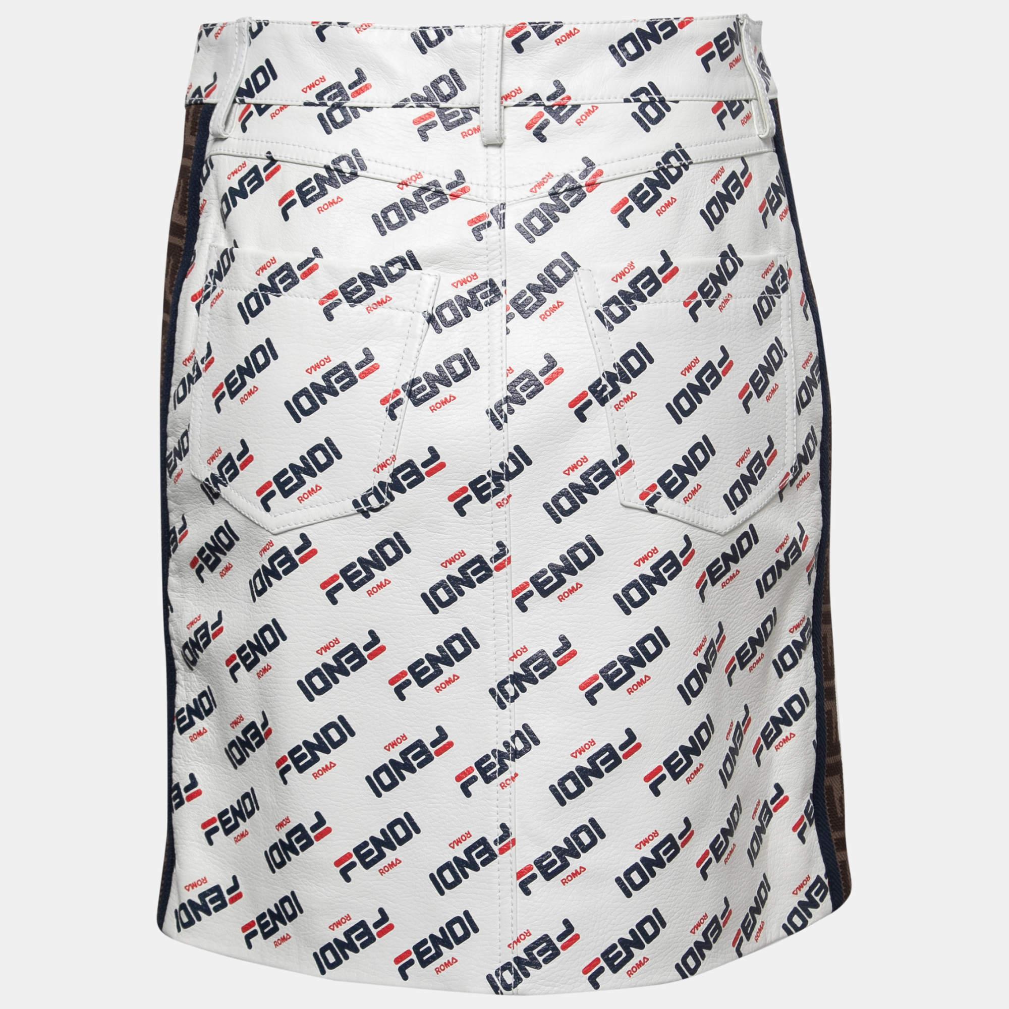 Ditch those regular skirts and go ahead with this fabulous number from Fendi! The white leather skirt has been designed with a 'FENDI ROMA' print all over and an 'FF logo trim detailing on the sides and comes equipped with a buttoned closure and
