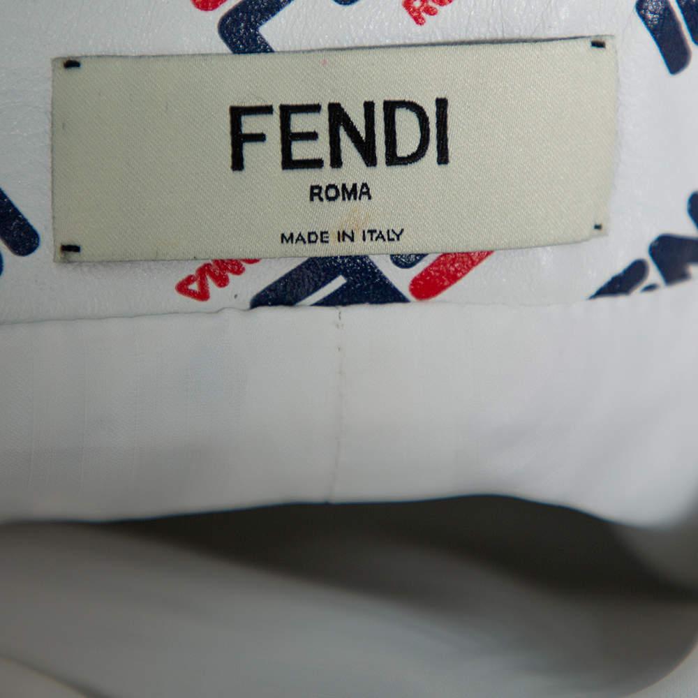 Ditch those regular skirts and go ahead with this fabulous number from Fendi! The white leather skirt has been designed with a 'FENDI ROMA' print all over and an 'FF logo trim detailing on the sides and comes equipped with a buttoned closure and