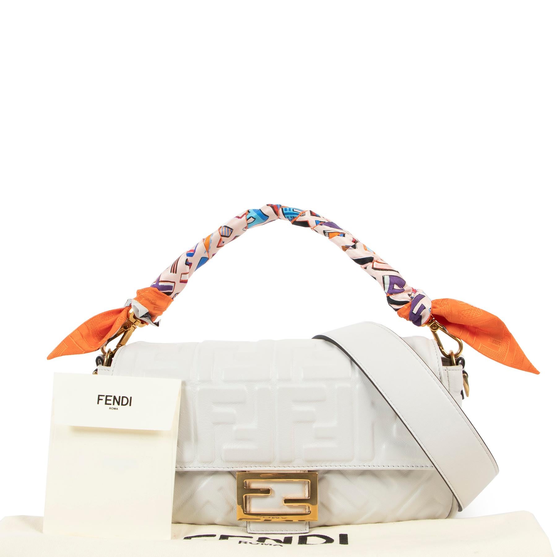 Fendi White Baguette Shoulder Bag + Multicolor Wrappy

The Baguette bag by Fendi was made popular in the 90's and is still every bit the icon nowadays. This medium Baguette bag is crafted out of  soft nappa leather with a three-dimensional tembossed