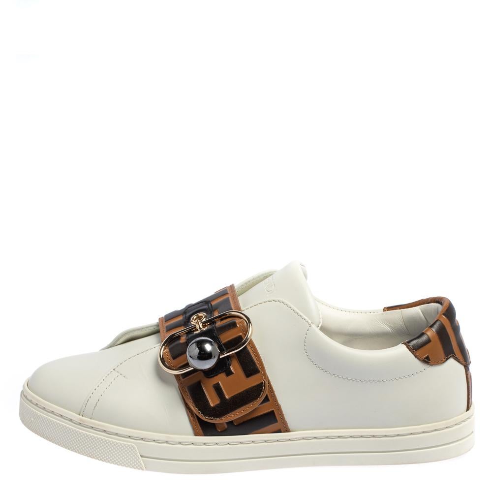 Flaunt your love for fashion by wearing these amazing slip-on sneakers from Fendi. They are expertly crafted from leather and feature the signature Zucca pattern detailed on the vamp straps and the counters. They are endowed with comfortable