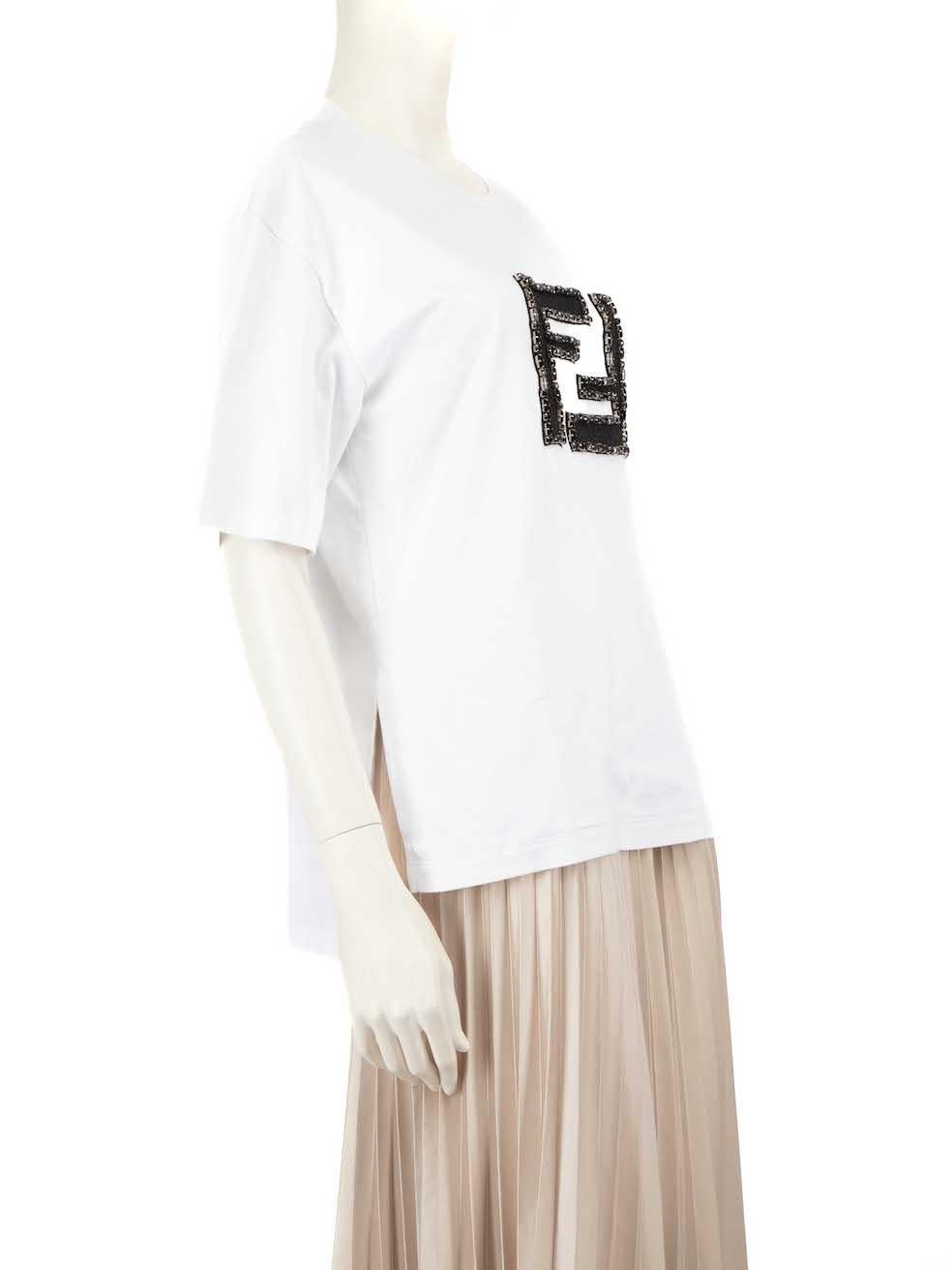 CONDITION is Very good. Minimal wear to top is evident where the brand label has become detached on one side on this used Fendi designer resale item.
 
 
 
 Details
 
 
 White
 
 Cotton
 
 T-shirt
 
 Round neck
 
 Embellished FF front logo
 
 
 
 
