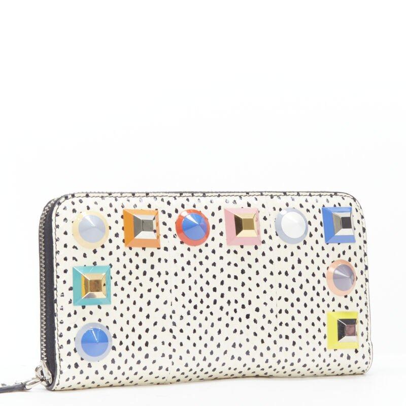 FENDI white dotted scaled leather Rainbow studs long zip continental wallet
Reference: MELK/A00175
Brand: Fendi
Model: Rainnbow stud wallet
Material: Leather
Color: White, Black
Pattern: Dotted
Closure: Zip
Lining:  Leather
Extra Details: 8-card